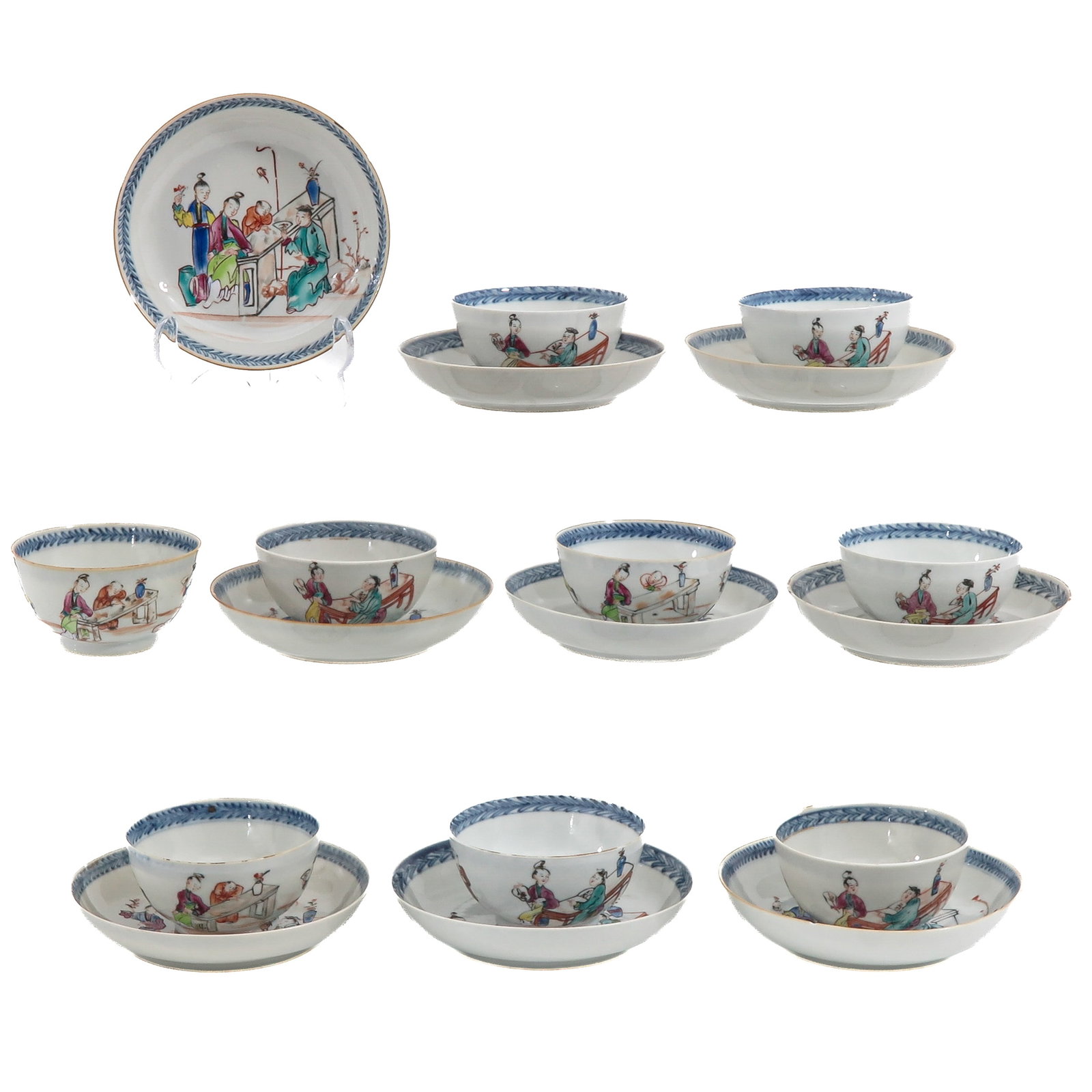 A Group of 9 Cups and Saucers: Decorated in Famille Rose enamels with figures in an interior, the rims with underglaze blue diaper borders, 18th Century, saucers are 13 cm. in diameter, chip and hairline.