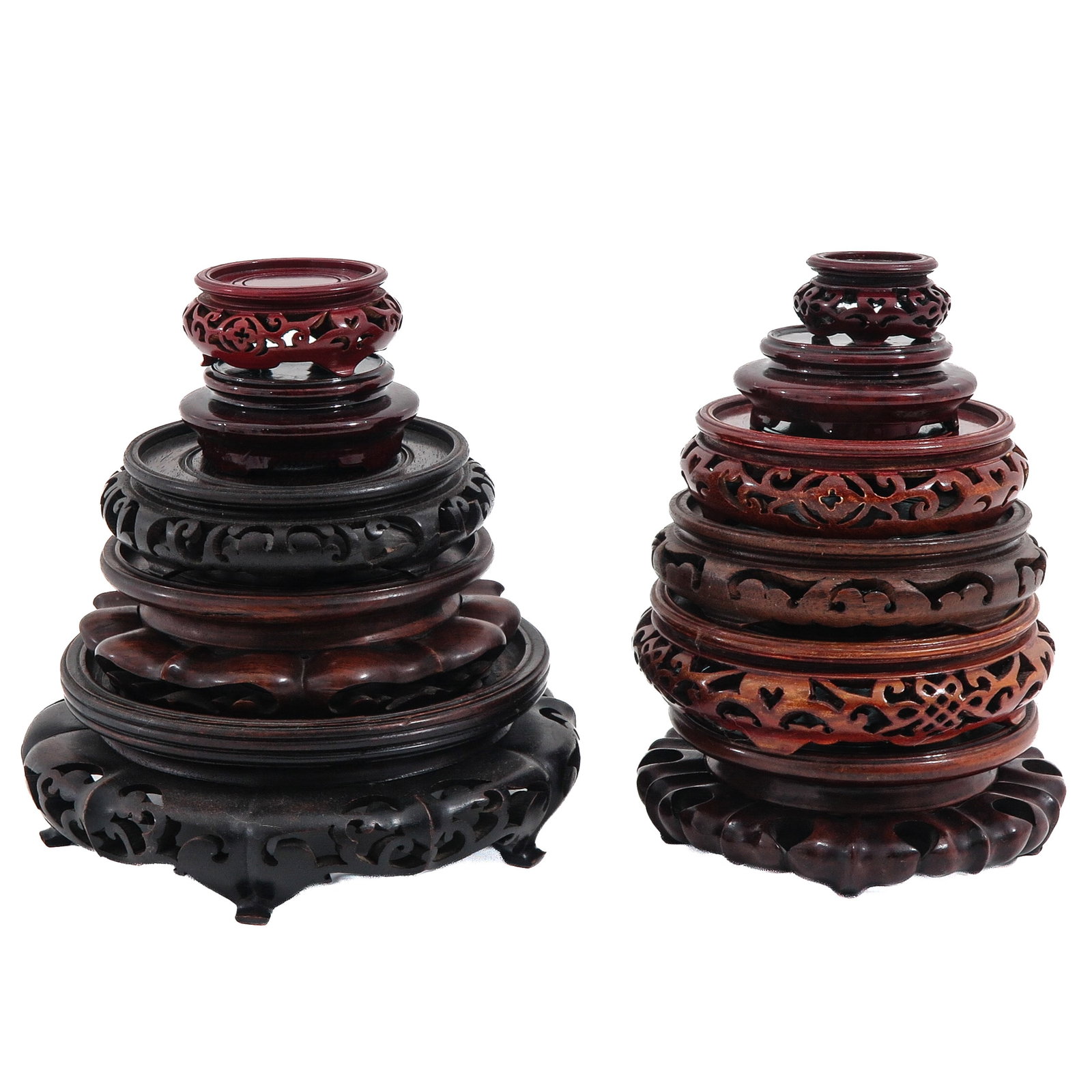 A Group of Carved Wood Bases: In various sizes and designs, including carved and openwork examples, largest is 24 cm. in diameter.