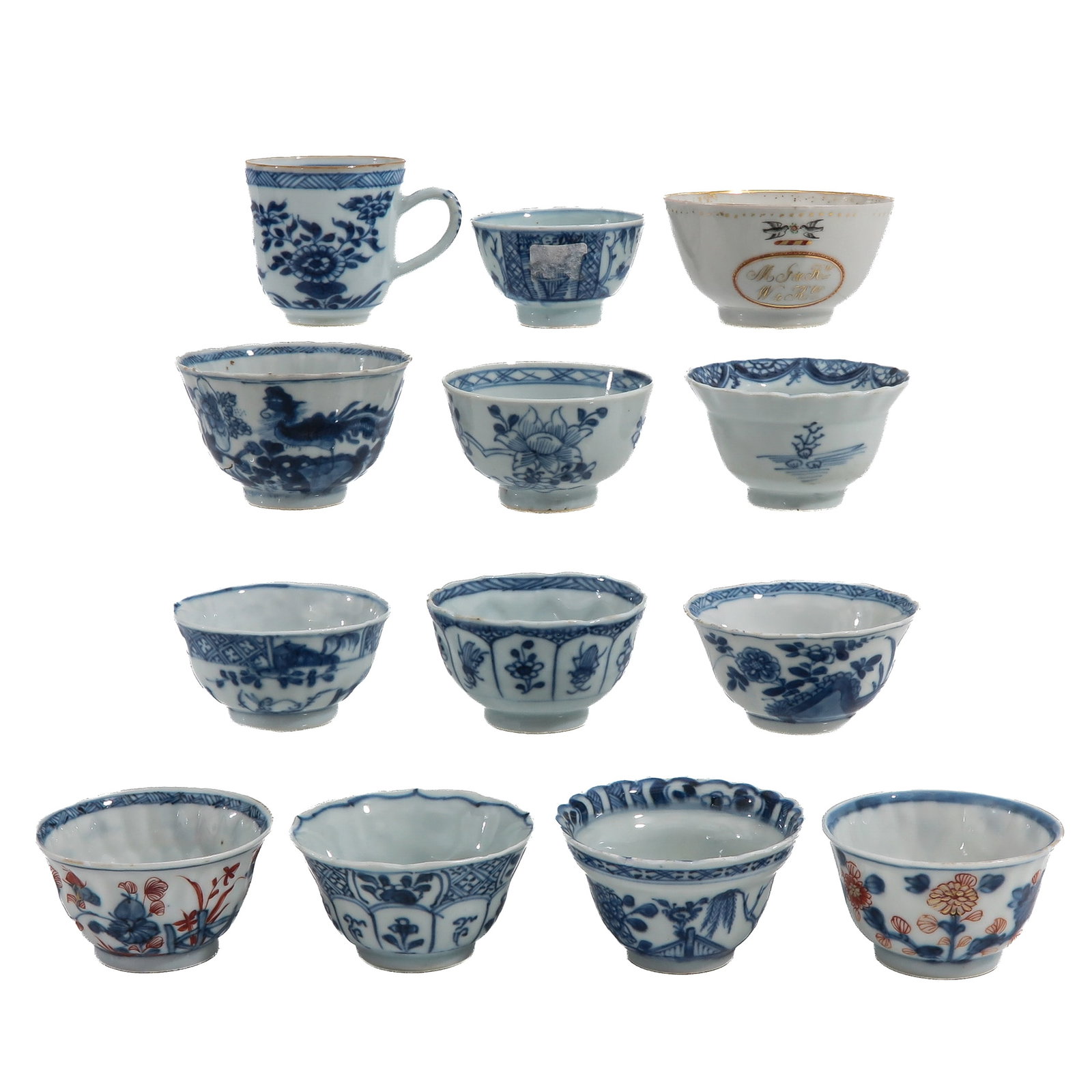 A Group of Cups and Saucers: Variously decorated with floral and landscape designs, including 18th Century, largest cup is 9 cm. in diameter, chip and hairline.