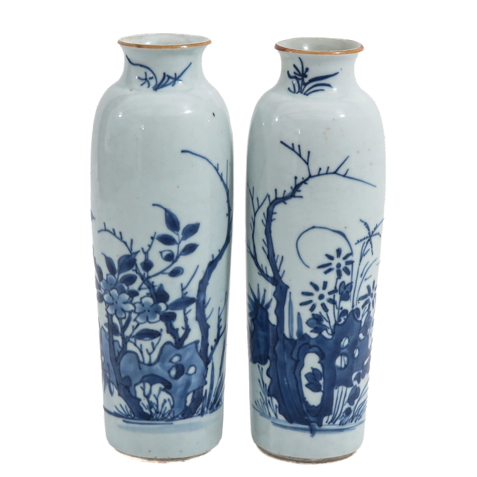 A Pair of Blue and White Vases: Depicting a scene in a garden with rocks and flowers, Transitional Period, 25 cm. tall, one with restoration.