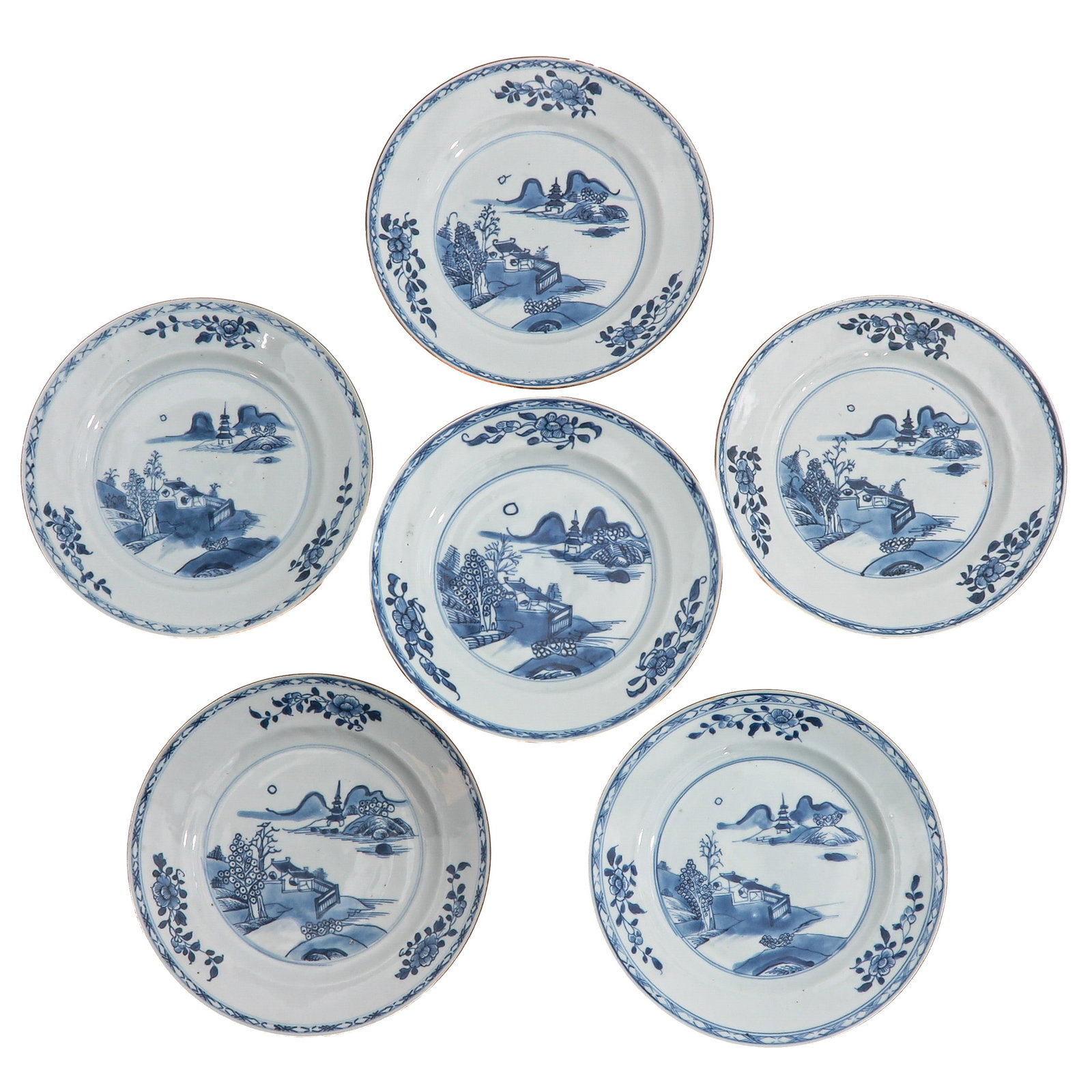 A Series of 6 Blue and White Plates: Decorated with a river landscape featuring pavilions and mountains within a floral border, 18th Century, 23 cm. in diameter, chip and hairline.