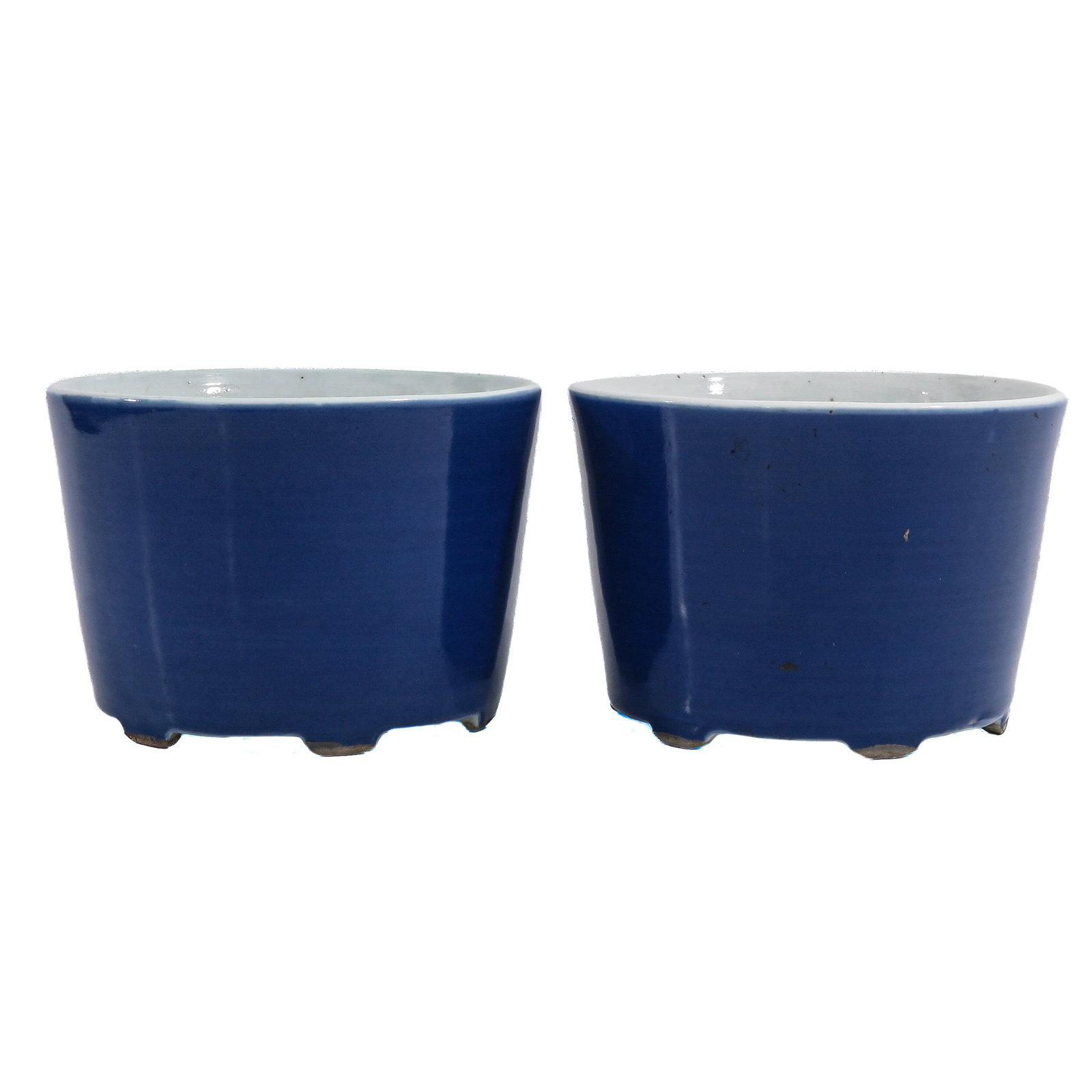 A Pair of Blue Monochrome Cachet Pots: Yongzheng mark, 14 cm. tall.