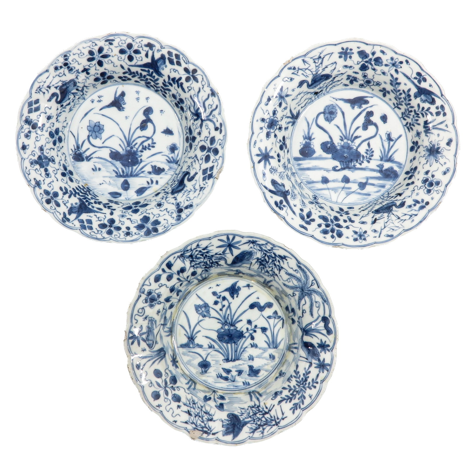A Series of 3 Blue and White Plates: Depicting a scene on a pond with ducks, circa 1800, 20 cm. in diameter, in diverse conditions.