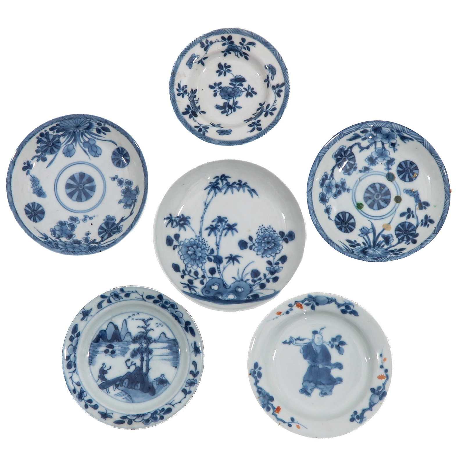 A Group of 6 Small Dishes: In a variety of blue and white decors, including 18th Century, largest dish is 11 cm. in diameter, chip.