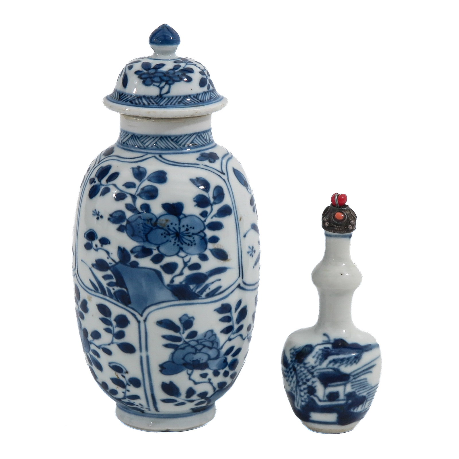 A Tea Caddy and A Snuff Bottle: Tea caddy decorated with flowering plants and rockwork, and a snuff bottle decorated with a landscape, tea caddy is 15 cm. tall.