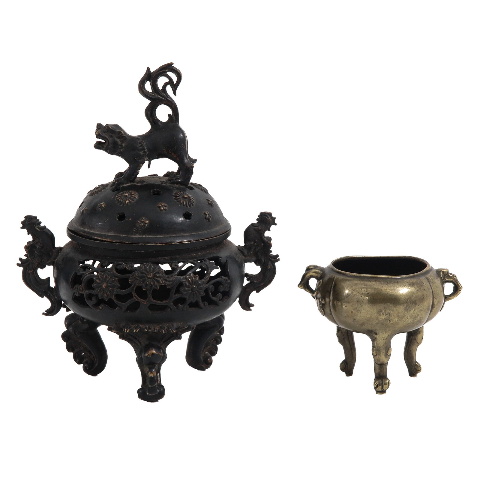 A Lot of 2 Bronze Censers: Comprising of a large pierced tripod censer with dragon handles with a domed cover with a Buddhist lion, and a smaller tripod censer with elephant head handles, tallest censer is 23 cm.