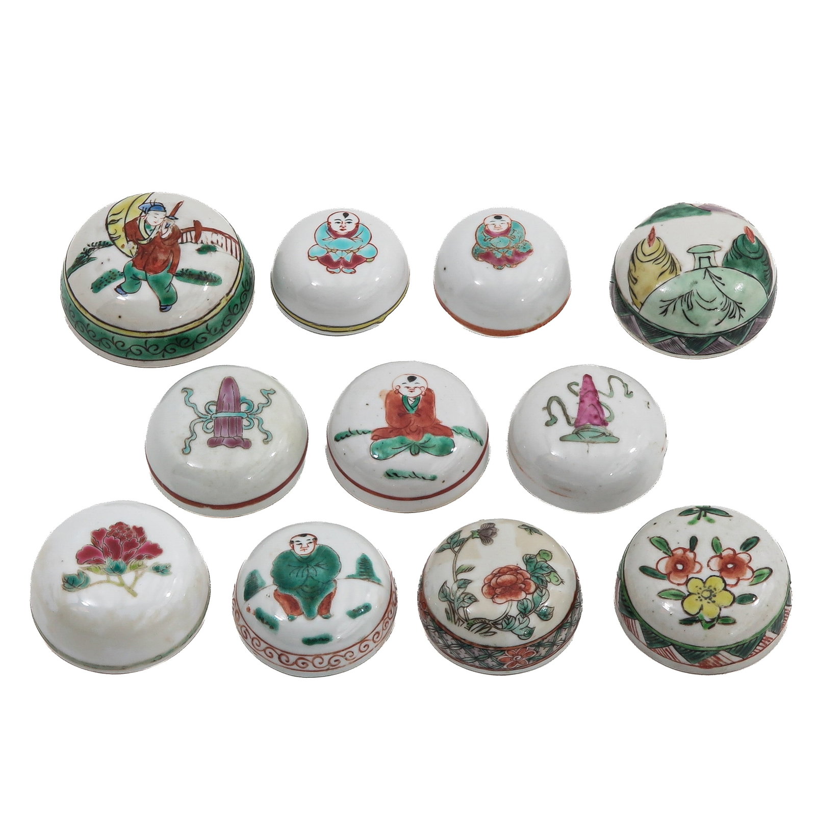 A Group of Famille Verte Porcelain Covers: In various sizes and decors, painted with figures, flowers and symbolic motifs, largest is 9 cm. in diameter.