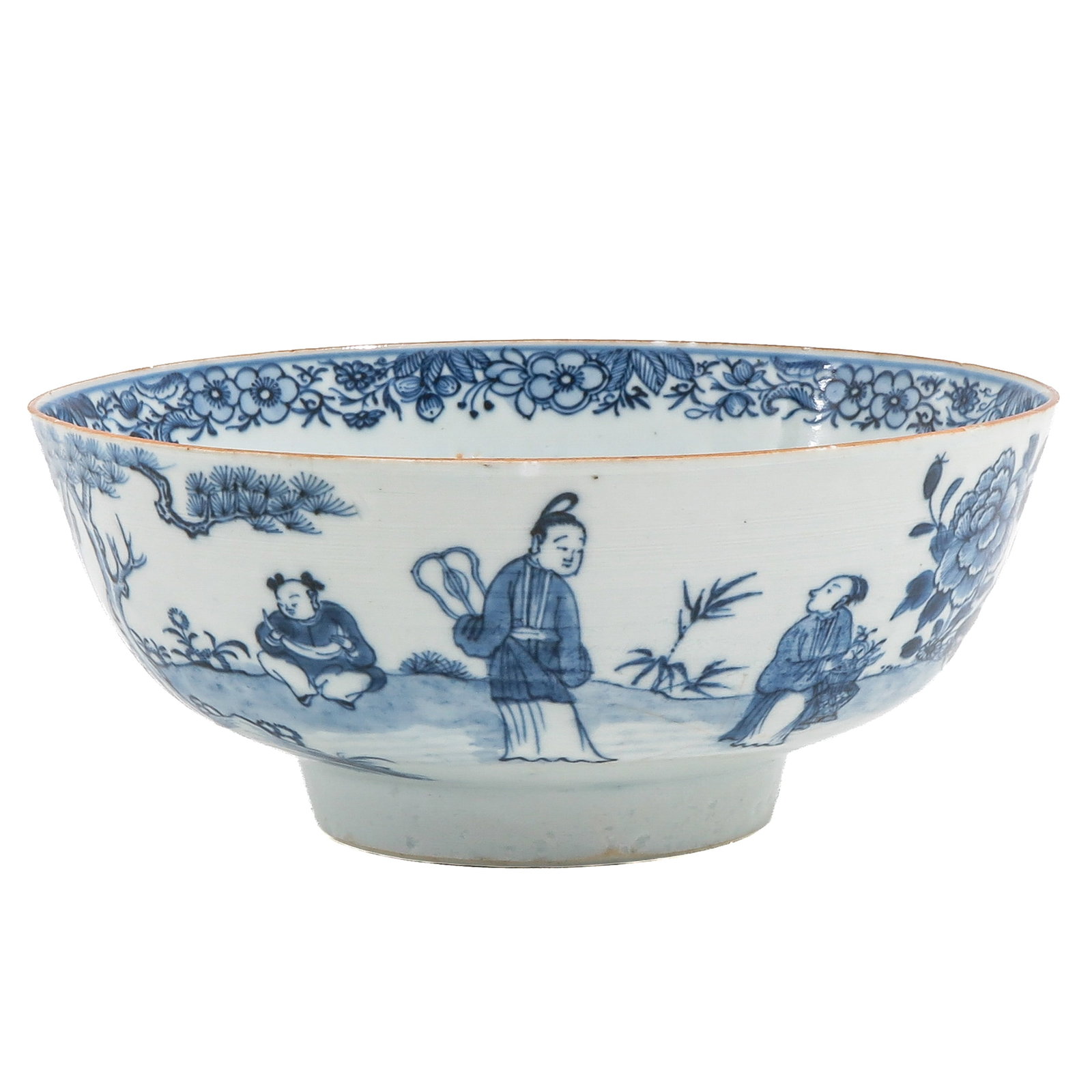 A Blue and White Bowl: Decorated with figures in a garden landscape beneath a floral border, 21 cm. in diameter, chip.