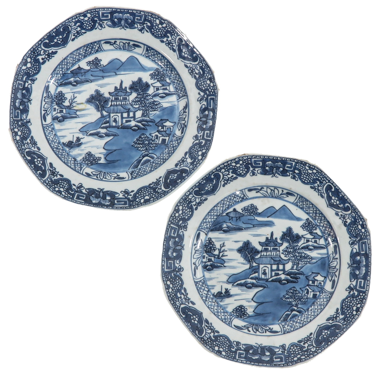 A pair of Blue and White Octagonal Plates: Decorated with a lakeside pavilion in a mountainous landscape within a floral border, circa 1800, 23 cm. in diameter, chip and hairline.