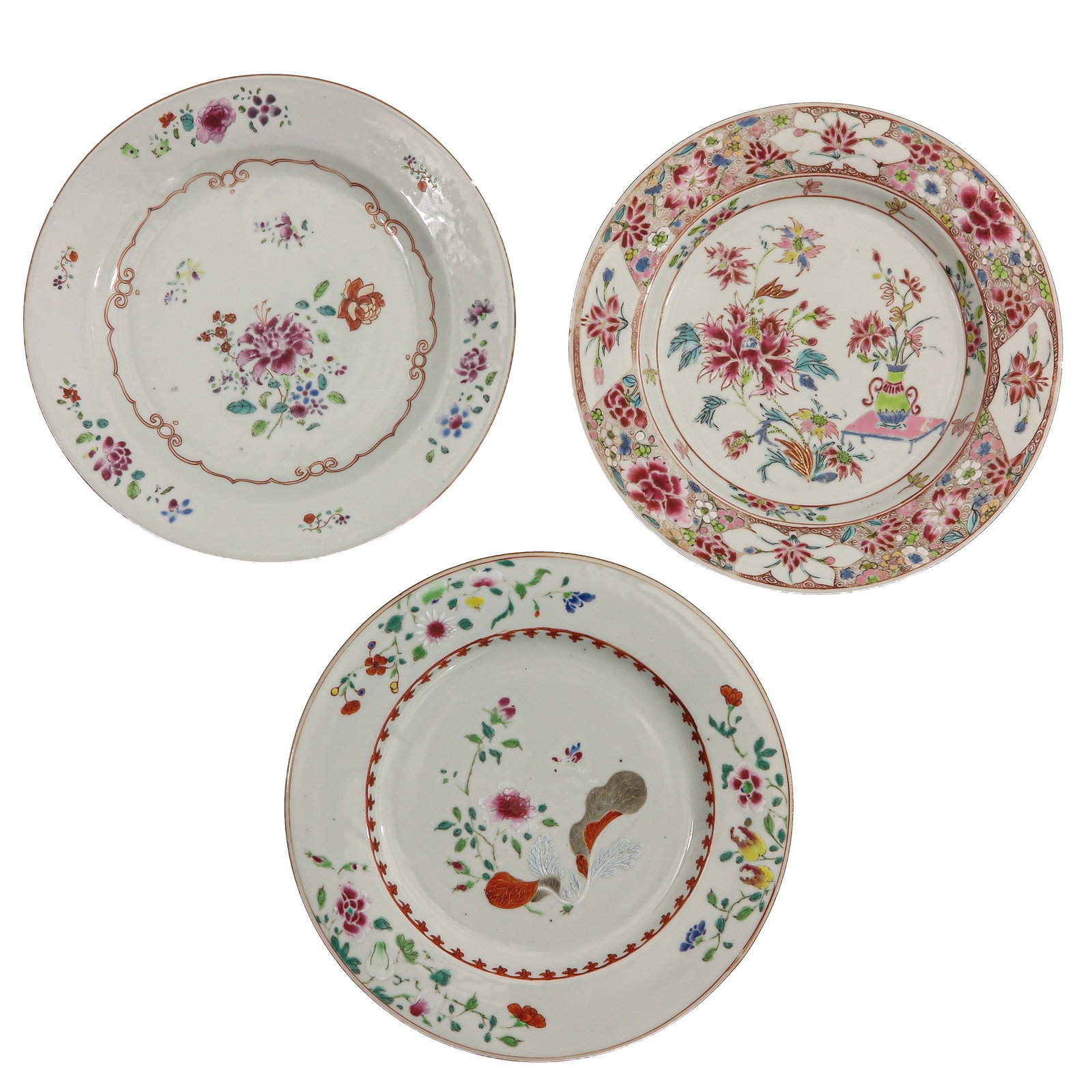 A Group of 3 Famille Rose Plates: Decorated with flowering plants, floral sprays and auspicious motifs, 23 cm. in diameter, 18th Century, chip and hairline.