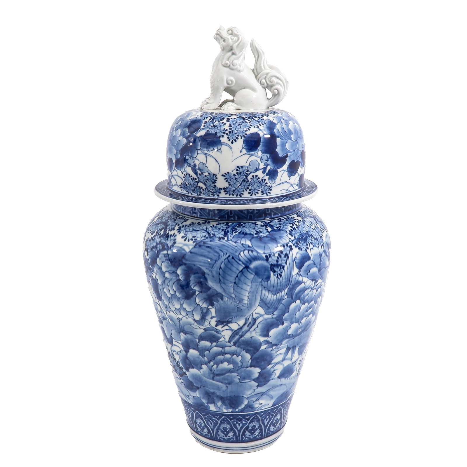 A Blue and White Covered Baluster Jar: decorated with phoenix among flowering peonies, the domed cover surmonted by a Buddhist lion finial, cover is restored, 71 cm. tall.