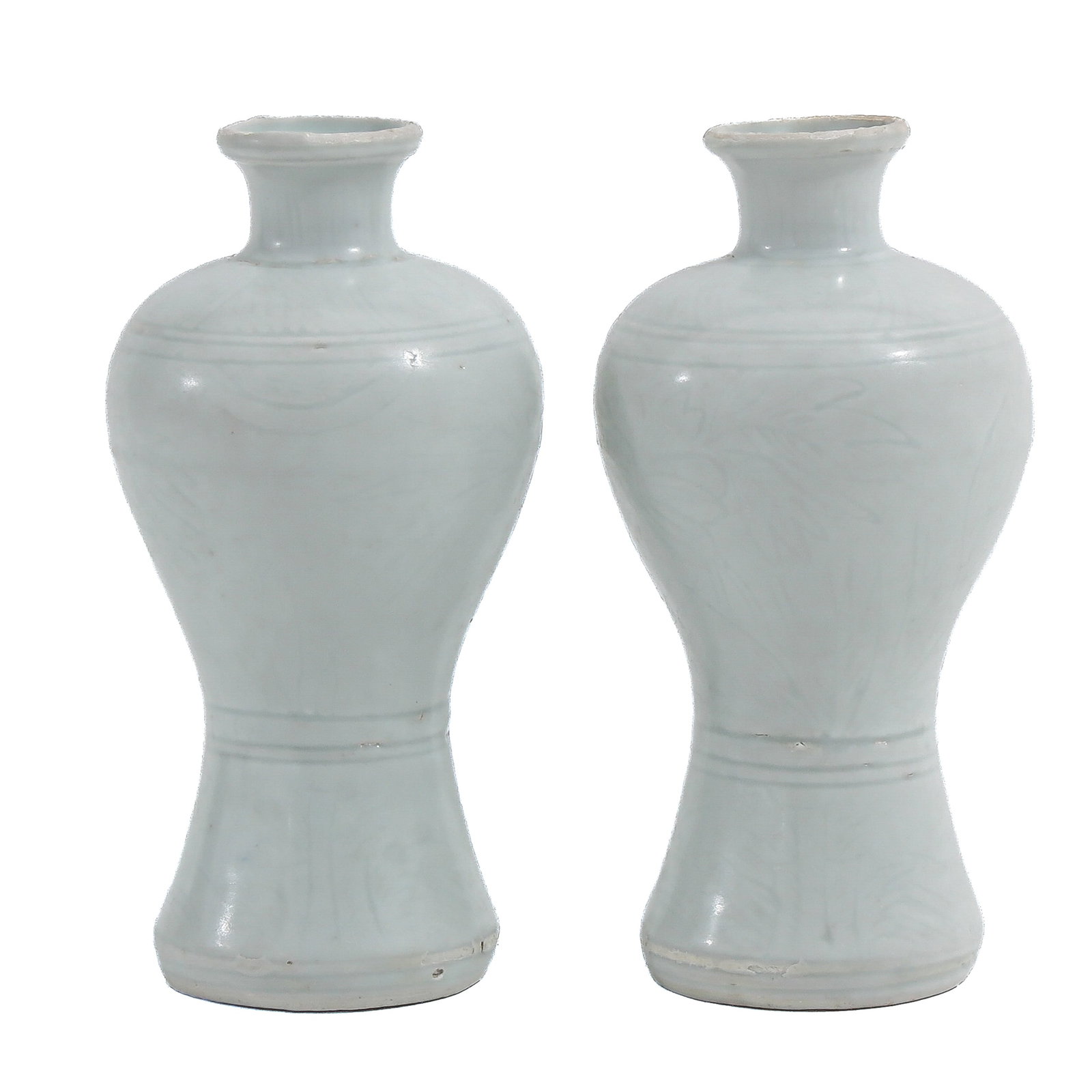 A Pair of White Glazed Meiping Vases: Ming dynasty, with incised floral decoration, 13 cm. tall.