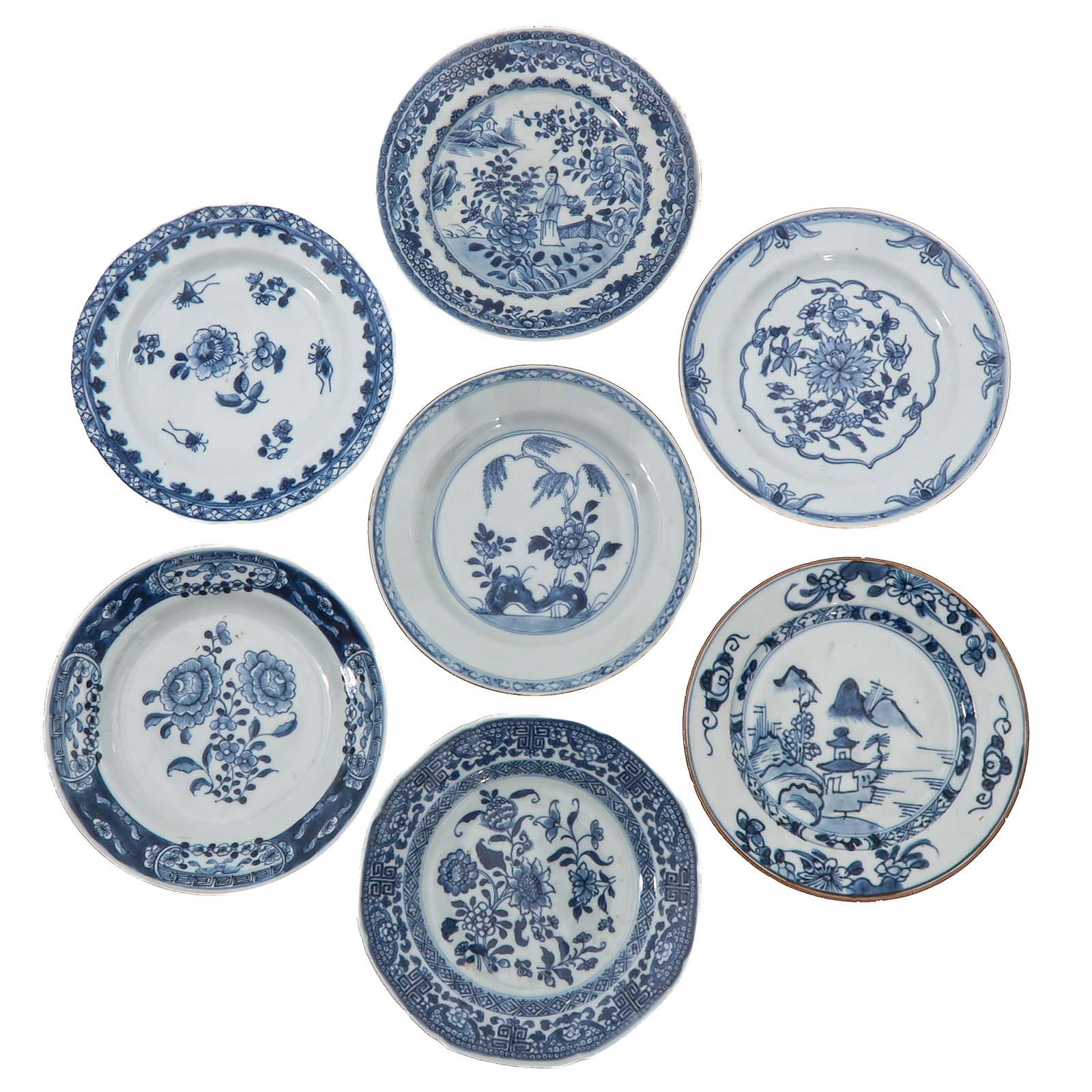 A Group of 7 Blue and White Plates: In a variety of decors, including floral, figural and landscape scenes, including 18th Century, largest dish is 16 cm. in diameter, chip and hairline.