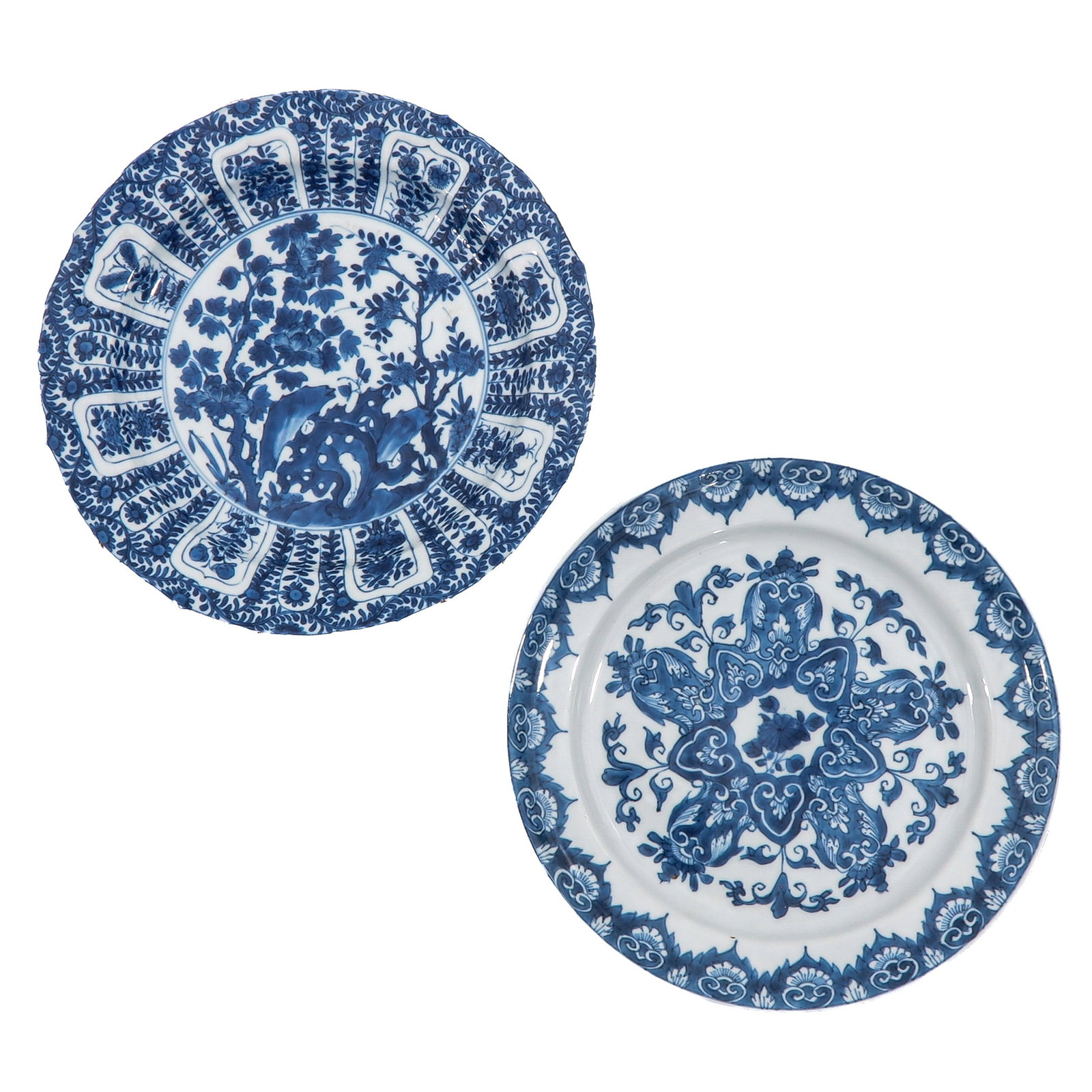 A Lot of 2 Blue and White Plates: One decorated with flowering branches and rockwork, the other with stylized lotus design, 18th Century, 24 cm. in diameter, fritting.