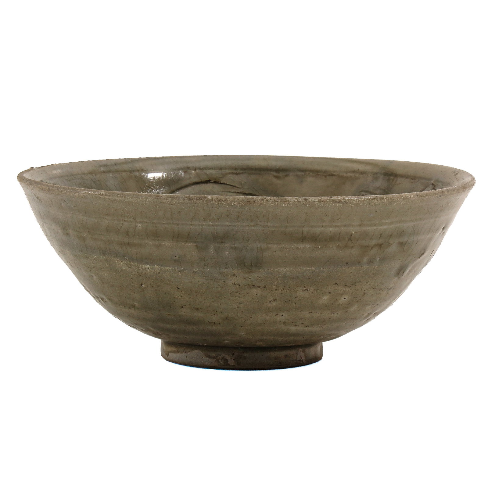 A Celadon Glazed Stoneware Bowl: Song/Ming dynasty, 16 cm. in diameter.
