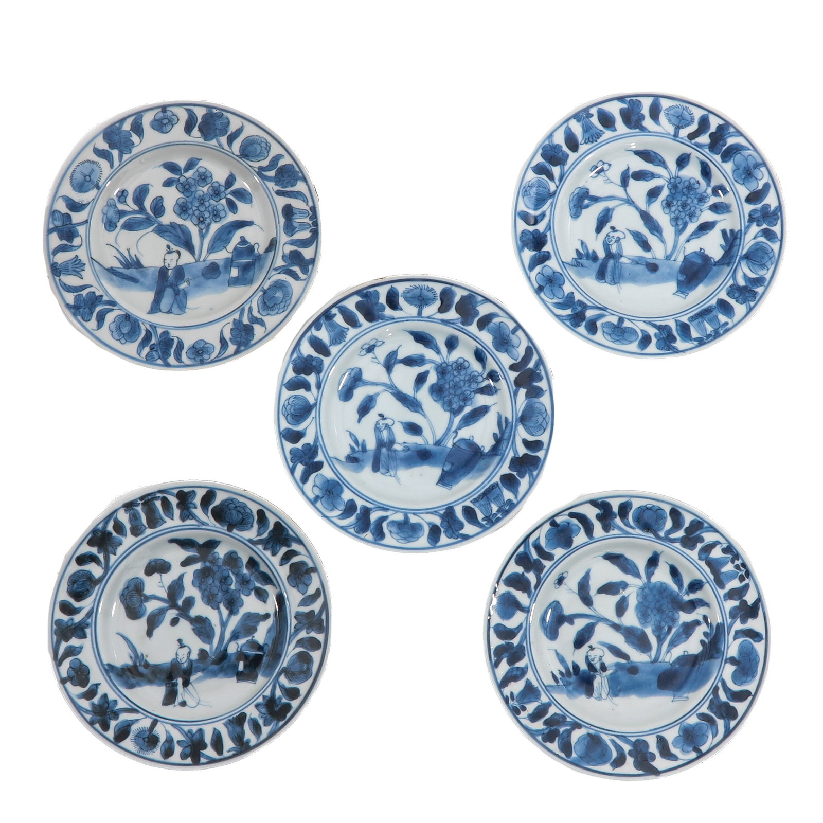 A Set of Blue and White Plates: Transitional Period, 17th Century, decorated with figures in a garden landscape amongst flowering plants , 15 cm. in diameter, chip.