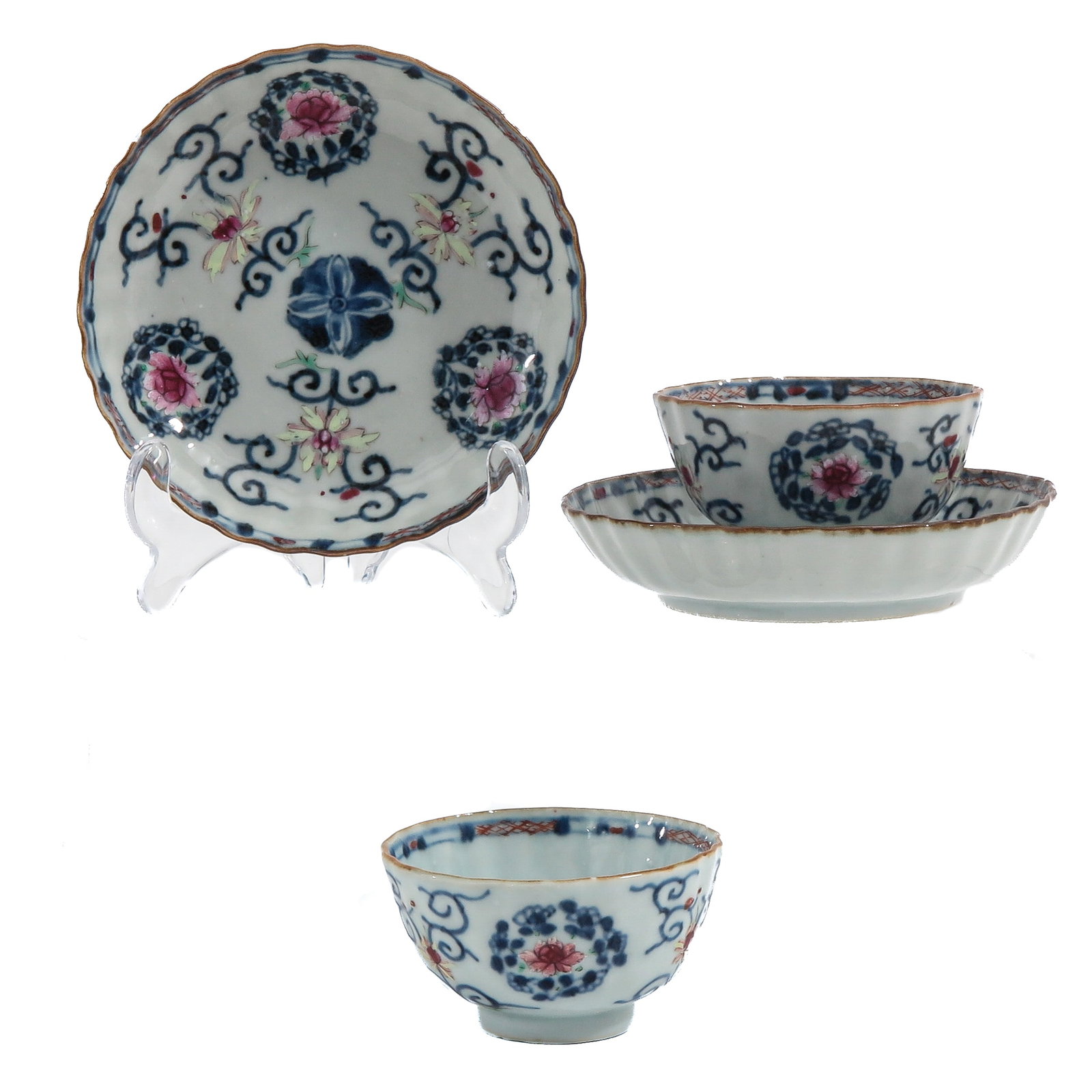 A Set of Cups and Saucers: Decorated in underglaze blue and polychrome enamels with stylized floral motifs, 18th Century, 13 cm. in diameter, hairline.