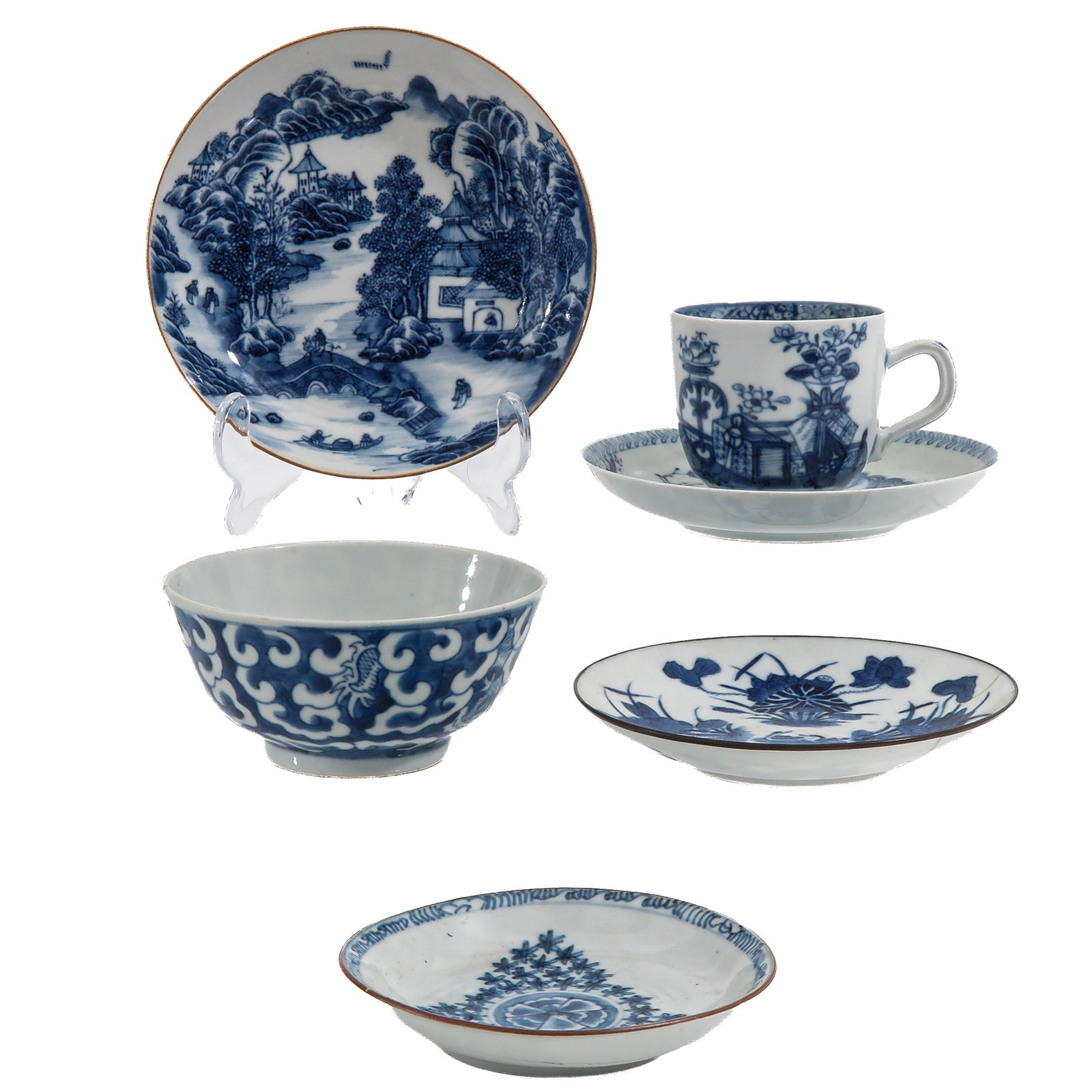 A Group of Blue and White Cups and Saucers: In a variety of decors, including 18th Century, largest saucer is 14 cm. in diameter, chip and hairline.