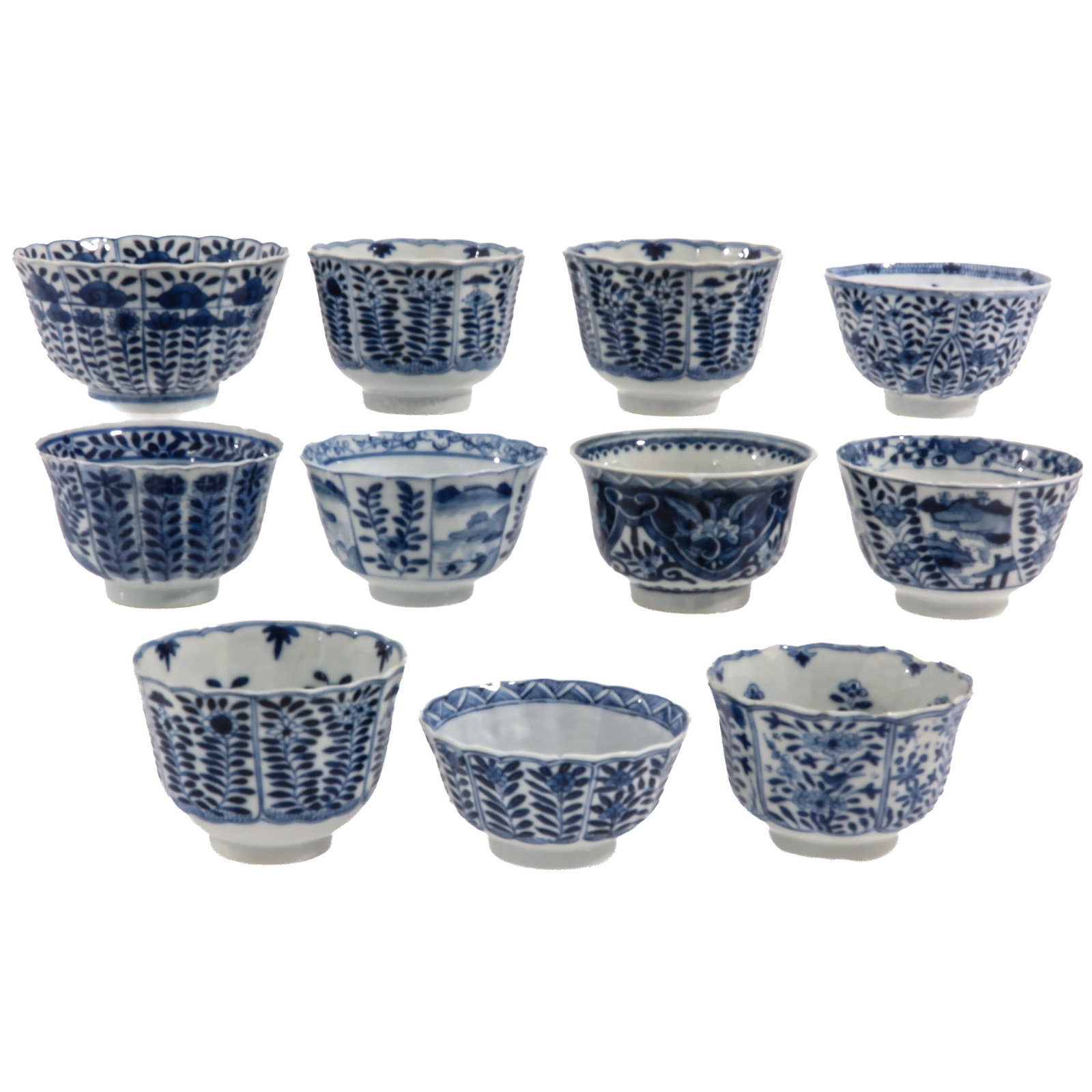 A Group of Blue and White Cups: Variously decorated with floral and foliate motifs, including 18th Century, largest cup is 10 cm. in diameter, chip and hairline.