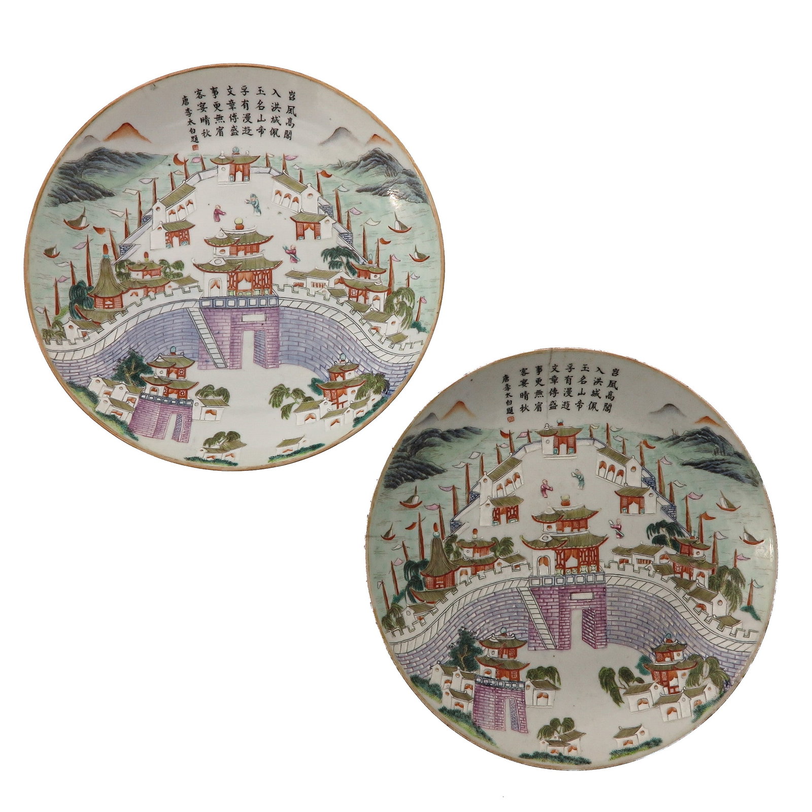 A Pair of Famille Rose Plates: Painted with coastal city with pavilions, figures, boats and mountains, with Chinese calligraphy, 22 cm. in diameter, hairline.