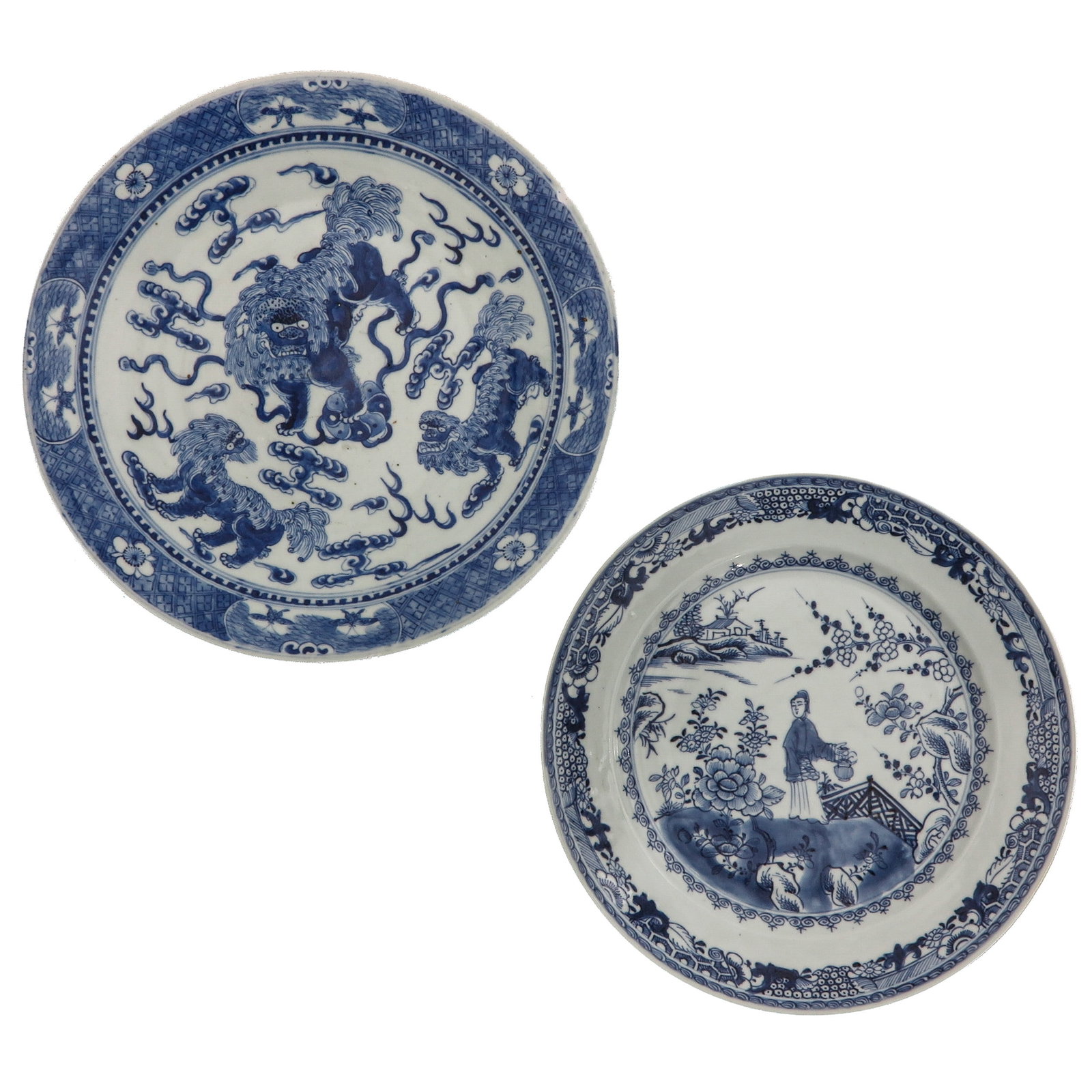 A Lot of 2 Blue and White Plates: One decorated with Buddhist lions amongst clouds, the other with a lady in a garden landscape, including 18th Century, largest plate is 31 cm. in diameter