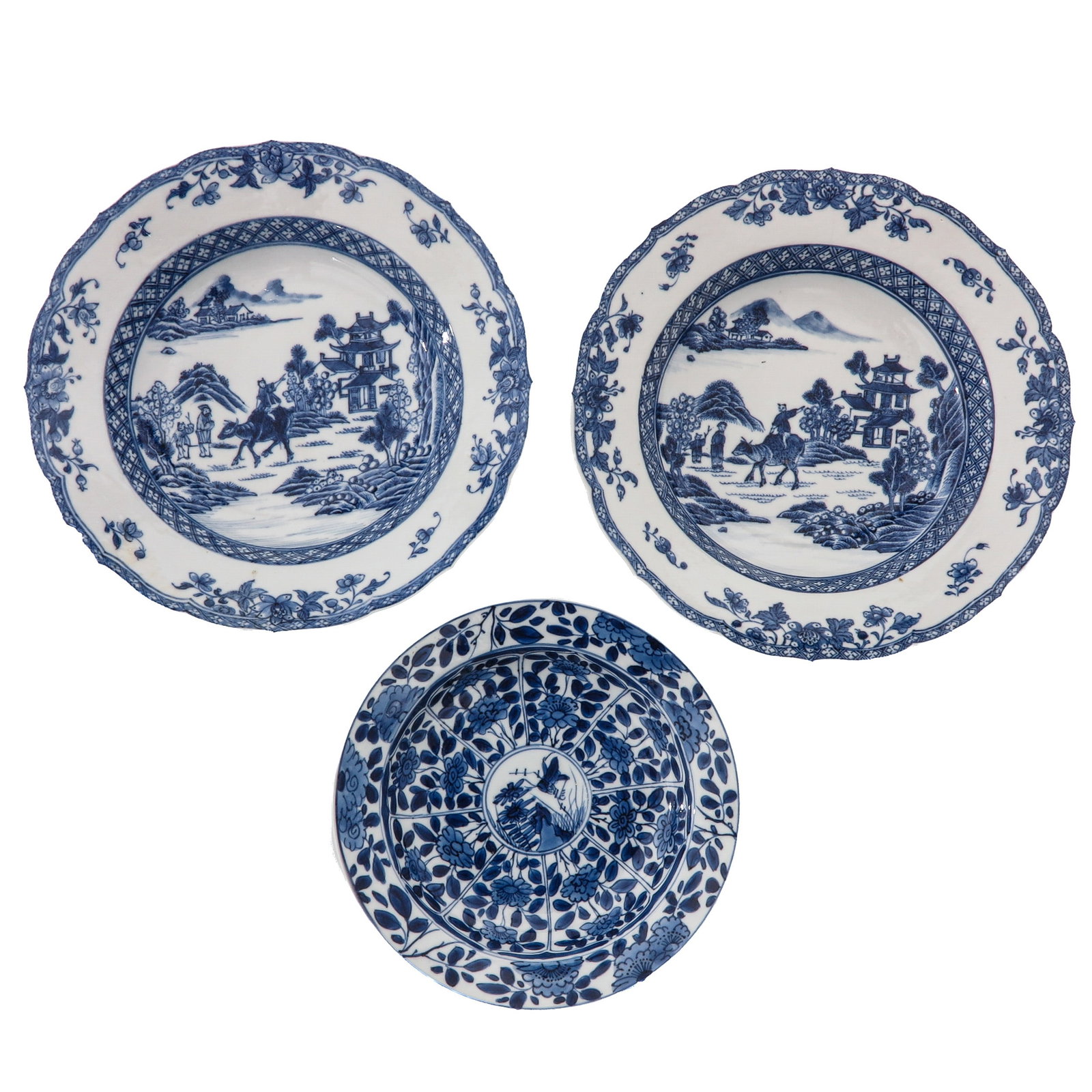 A Group of 3 Blue and White Plates: Including a pair decorated with river landscapes and a dish with floral panels and a central motif, 18th Century, largest plate is 20 cm. in diameter, chip and hairline.