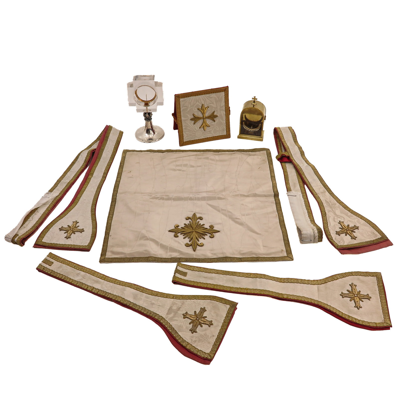Group of Liturgical Vestments: consisting of various liturgical vestments and accessories, including a monstrance with luna and a luna holder