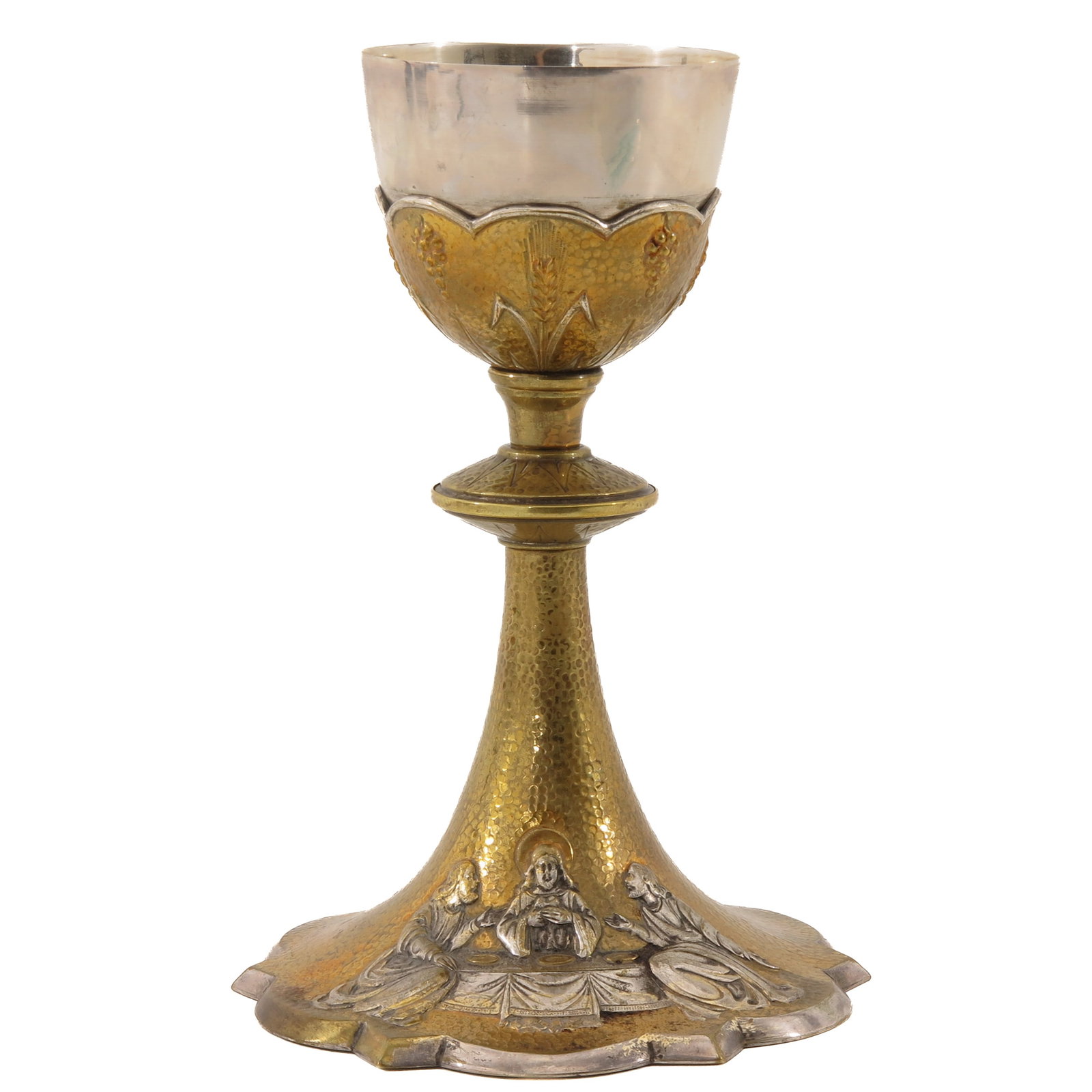 A Chalice: gilt with silver cuppa, the foot decorated with a depiction of the disciples at Emmaus at the table, rare execution, height 21 cm.