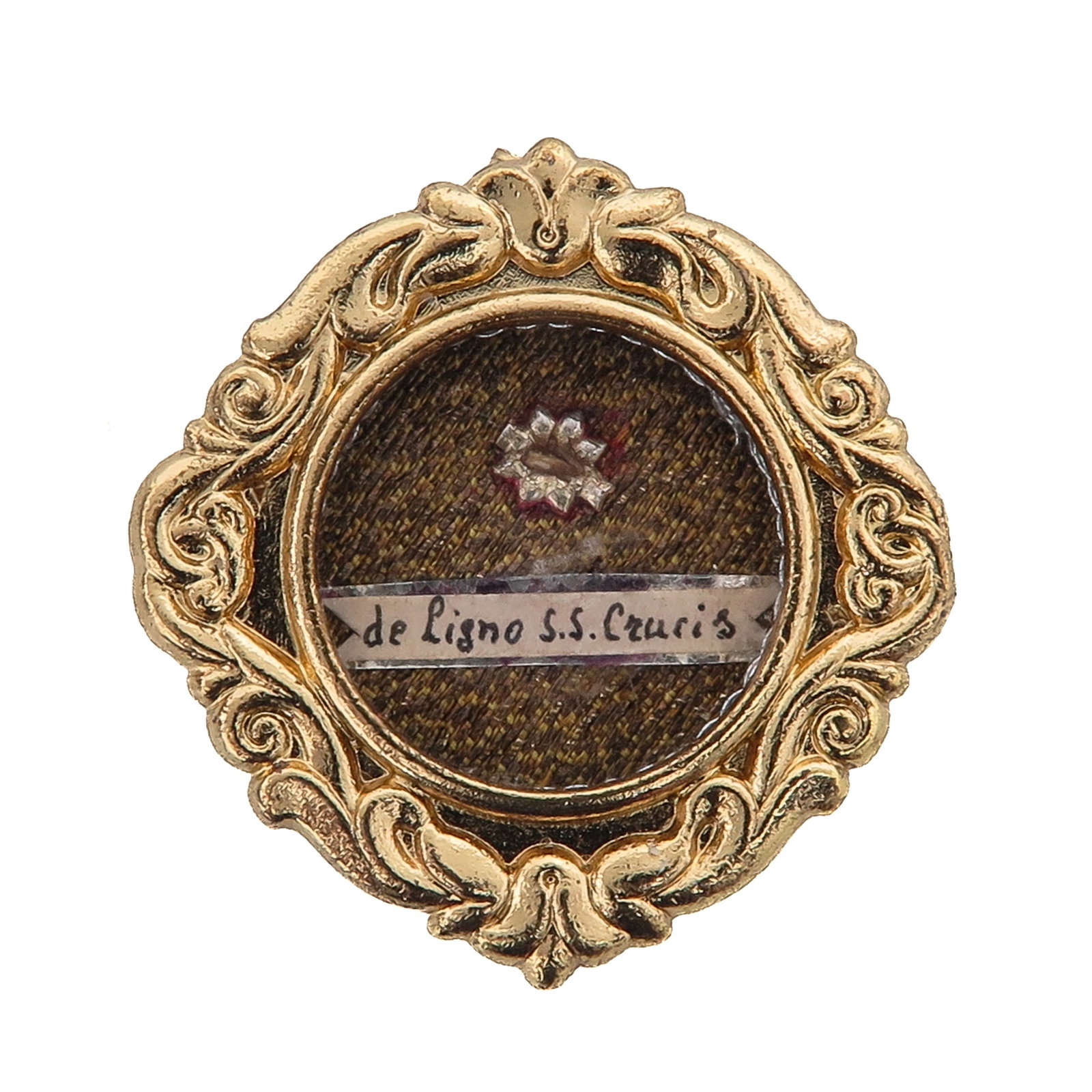 A Sealed Theca: gilt brass, containing a relic of the wood of the Holy Cross, de ligno Sanctissimae Crucis, with certificate, you are purchasing the theca, the relic is a gift, 3 x 3 cm.