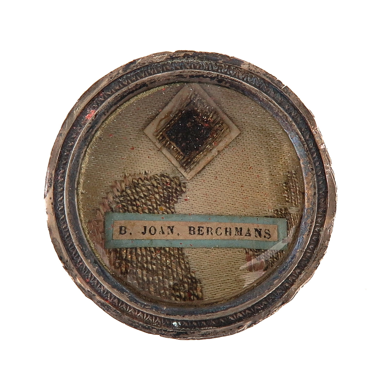 A Sealed Theca: containing relic of Blessed John Berchmans, Jesuit, patron of altar servers and students, you are purchasing the theca, the relic is a gift, diameter 4 cm.