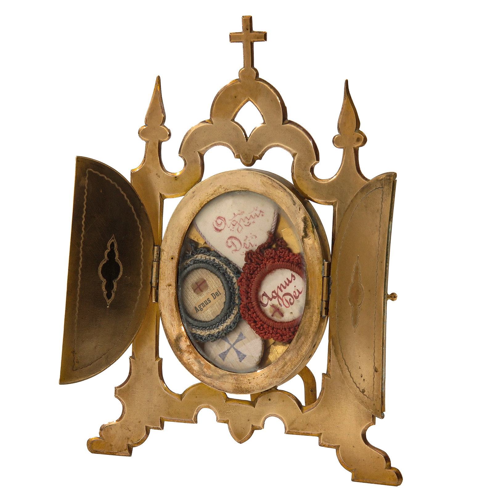 A Relic Frame: of gilt brass,including a relic of Agnus Dei (consecrated wax), you are purchasing the relic frame, the relic is a gift, 14 x 19 cm.