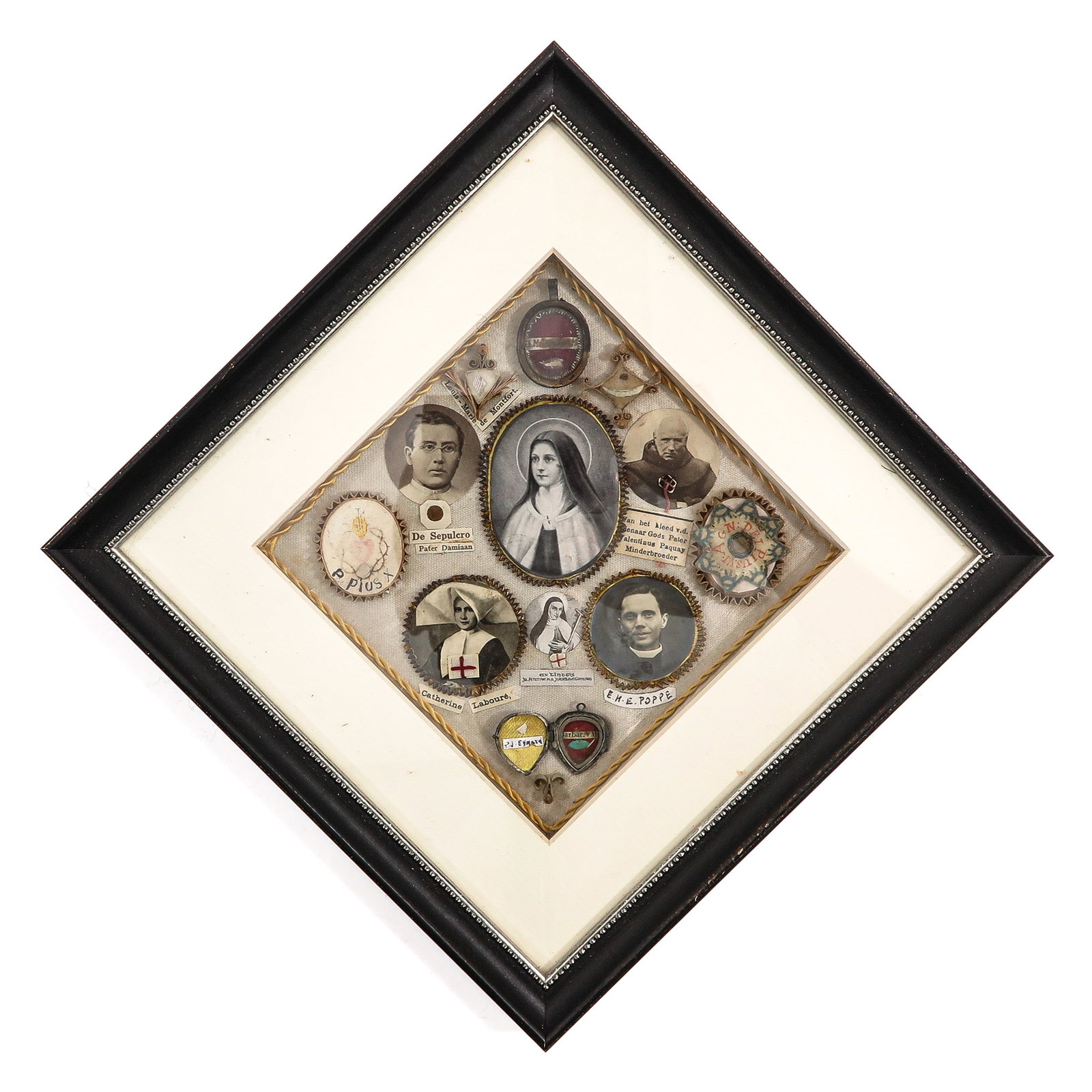 A Relic Frame: with various relics, including relics of popes, with portrait medallions and devotional representations, 21 x 21 cm.