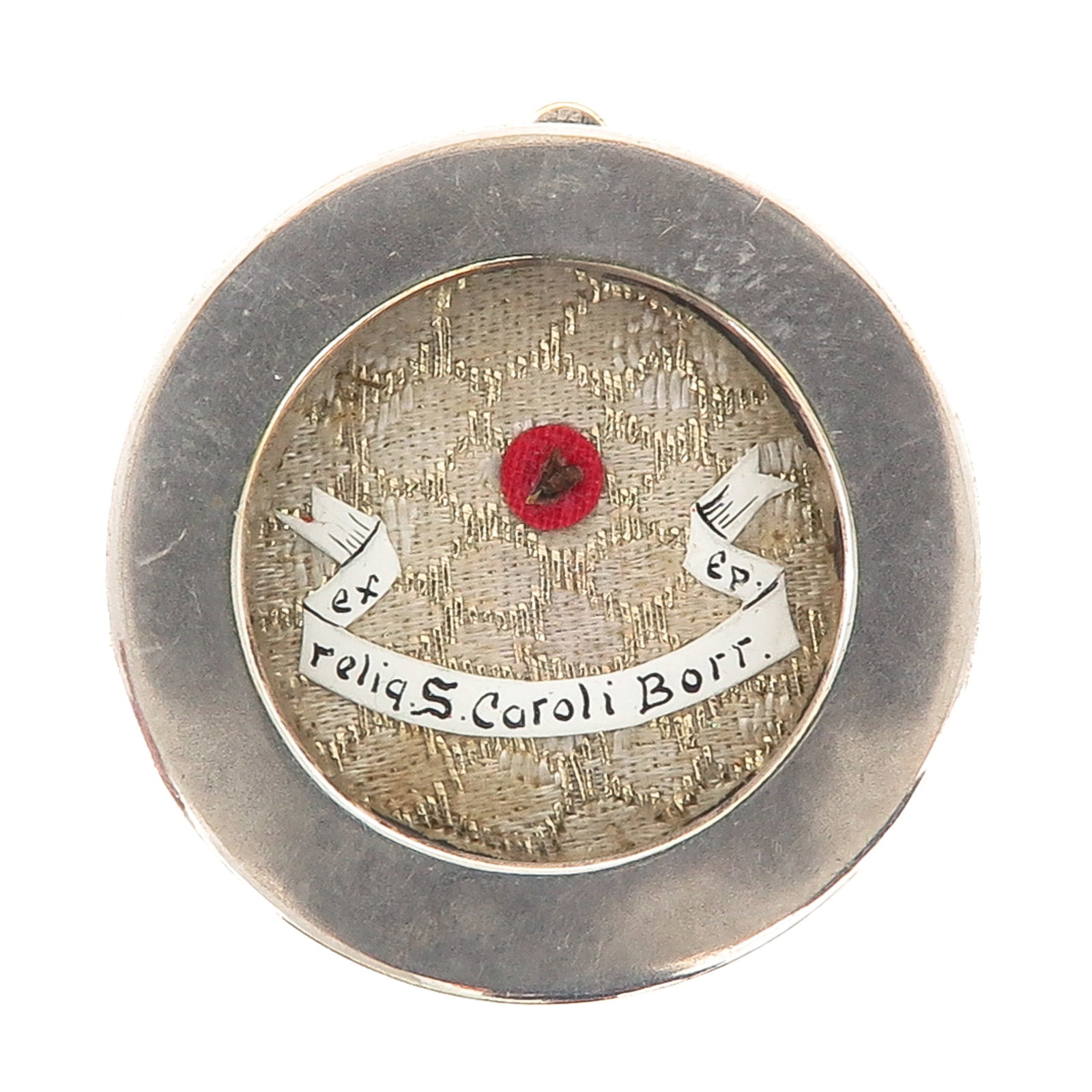 A Sealed Theca: containing relic of Saint Charles Borromeo, cardinal and archbishop of Milan, patron of bishops and seminarians, you are purchasing the theca, the relics are a gift, diameter 5 cm.