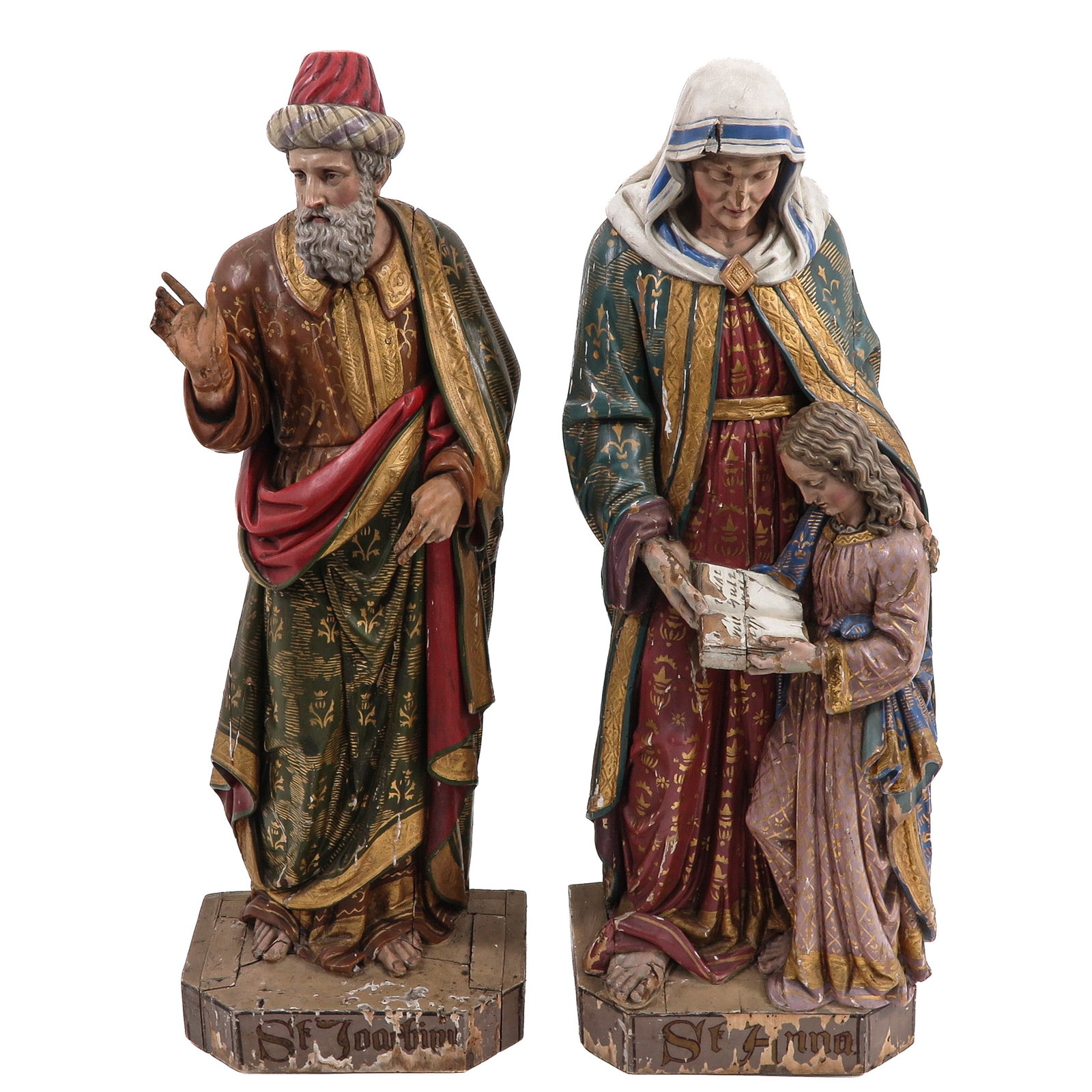 A Pair of Polychrome and Gilt Wooden Figures: polychrome and gilt wooden figures of saints, Saint Joachim, the husband of Anne and Saint Anne, the mother of the Virgin Mary, depicted with the young Mary, very rare pair, height 97 cm.