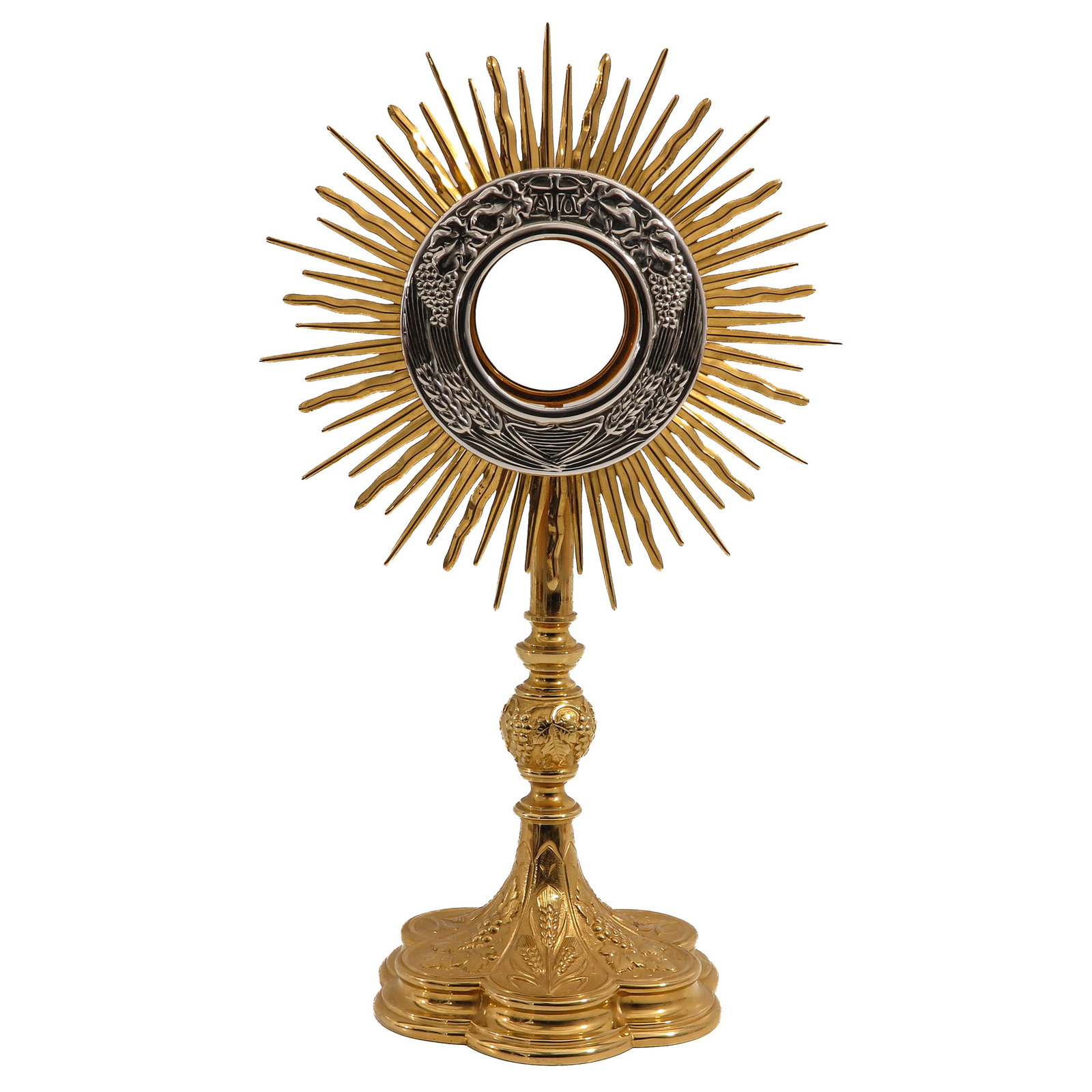 A Monstrance: richly gilt, with sunburst, lunette provided with grape clusters, with floral and Eucharistic decoration, height 45 cm.