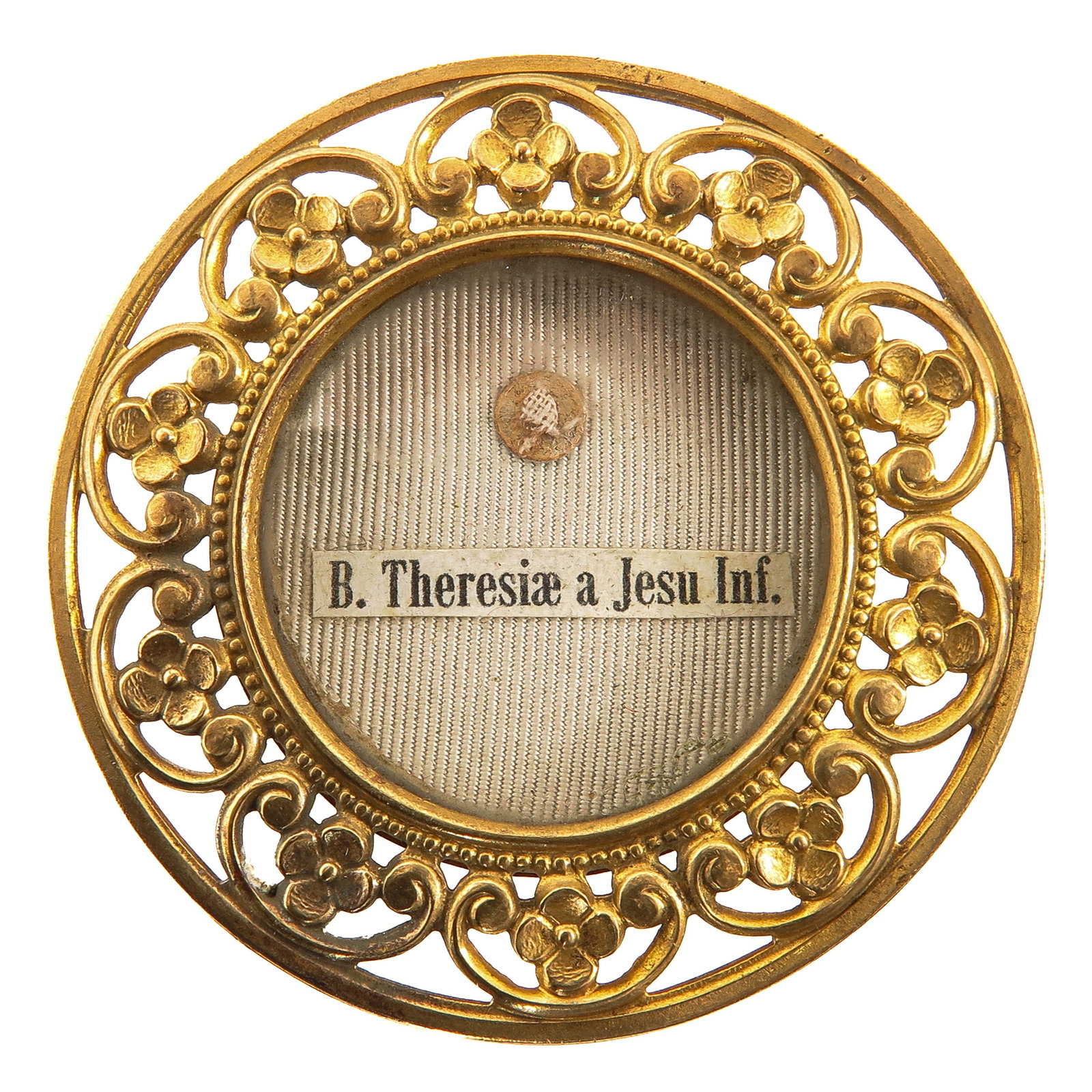 A Sealed Theca: gilt and openwork with floral decoration, with relic of Blessed Th?rse of the Child Jesus, Carmelite, Doctor of the Church and patron saint of the missions, known for her little way of simplicity,