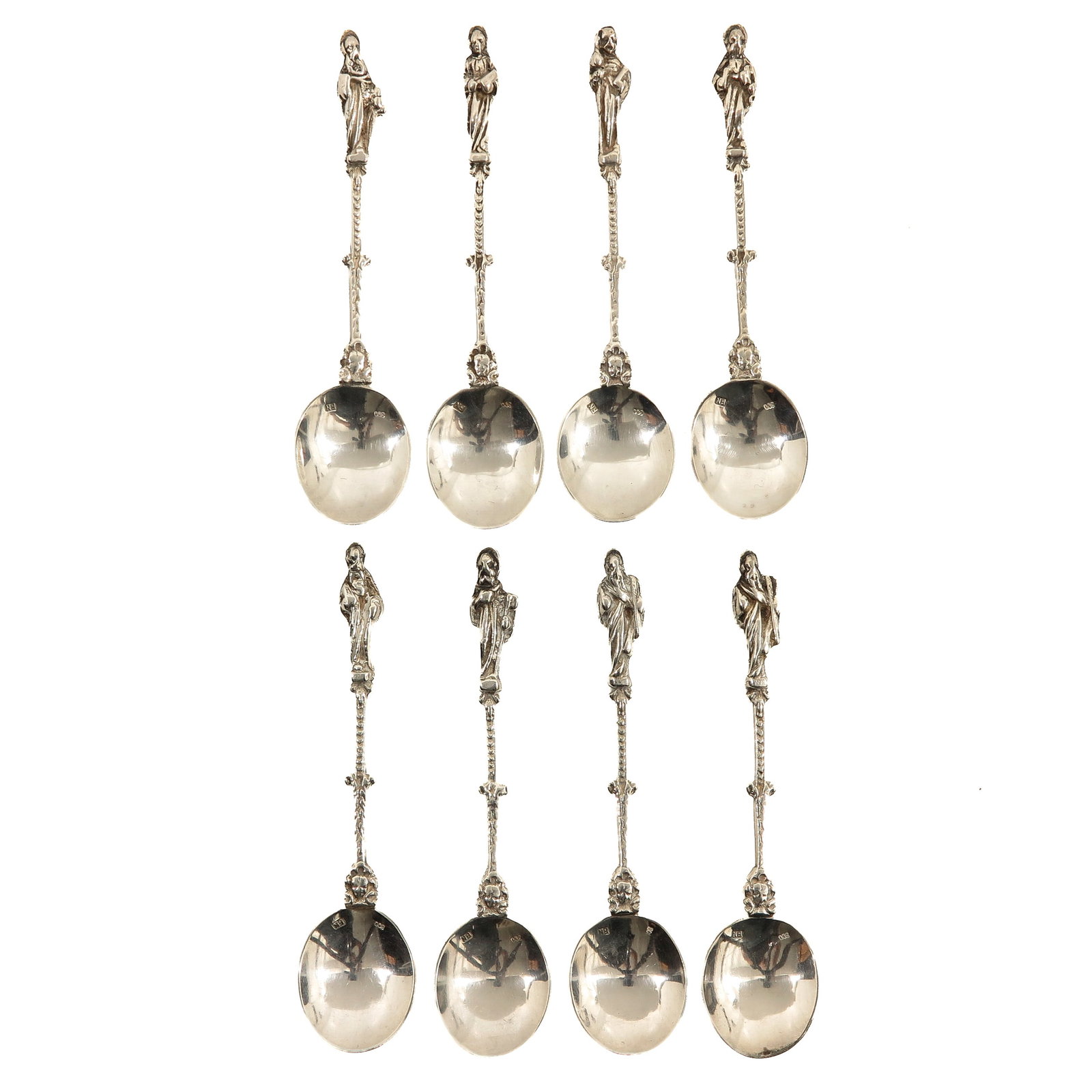 A Group of Silver Apostel Spoons: consisting of 8 silver apostle spoons, provided with a handle surmounted by a depiction of an apostle, length 11 cm.