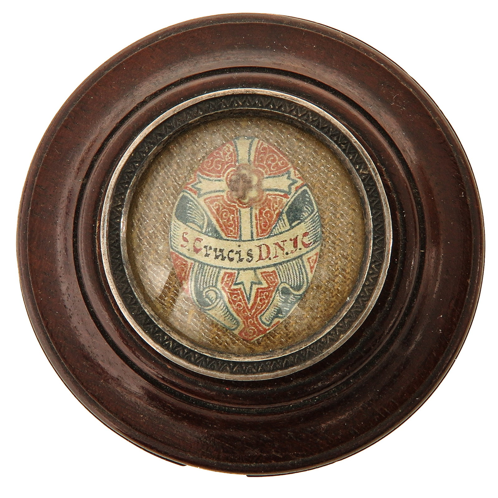 A Sealed Theca: wood, with silver mount on the reverse (hallmarked), with relic of the Holy Cross, you are purchasing the theca, the relic is a gift, diameter 7 cm.
