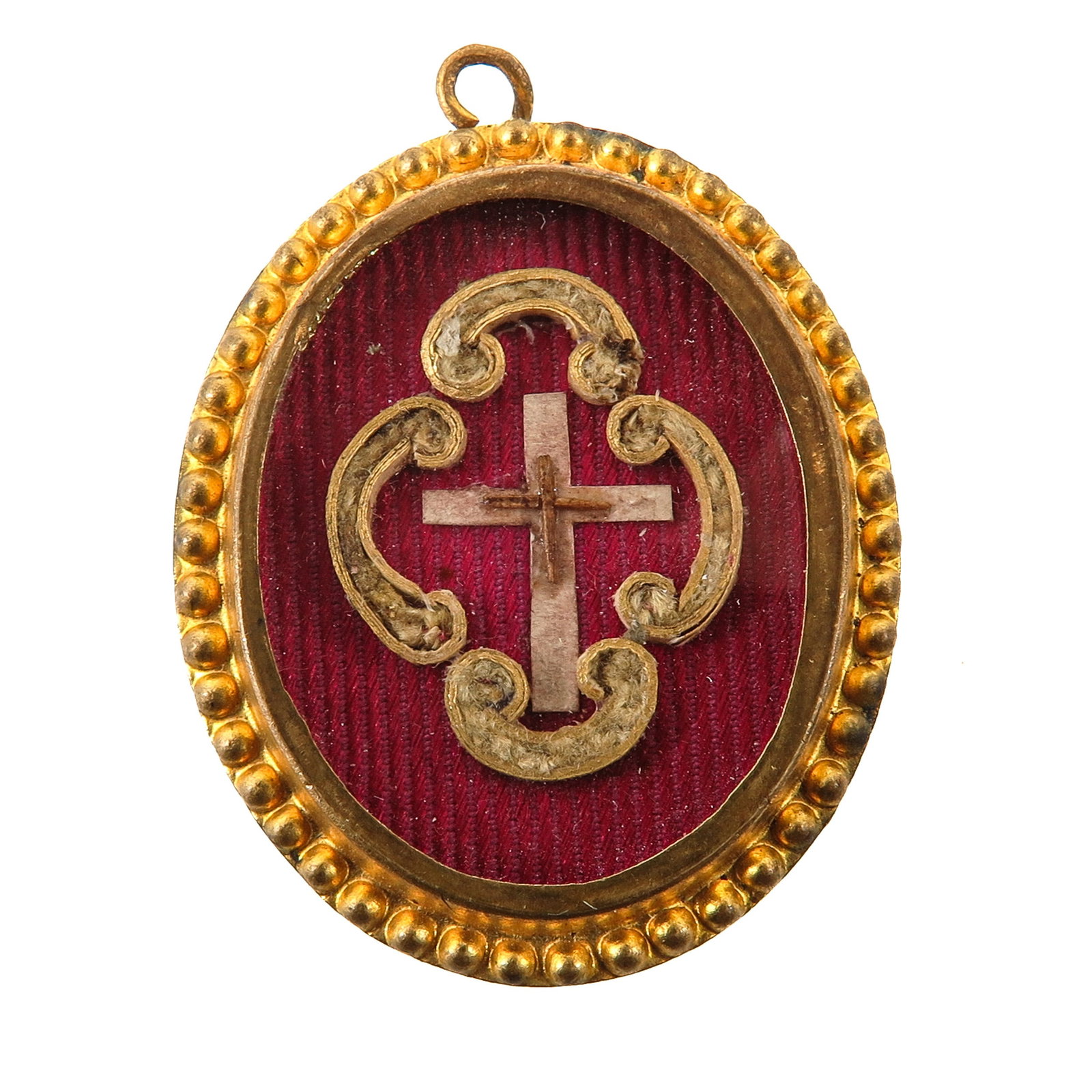A Sealed Theca: gilt brass, with relic of the Holy Cross, executed with a central cross, you are purchasing the theca, the relic is a gift, 3 x 4 cm.