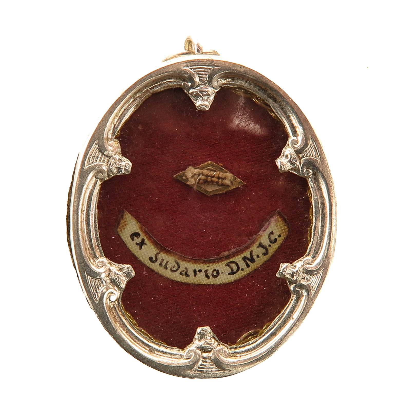 A Sealed Theca: silver, with relic ex Sudario D.N.J.C. (ex Sudario Domini Nostri Jesu Christi - of the shroud of Our Lord Jesus Christ), the reverse with a depiction of the Crucifixion, you are purchasing the theca, 