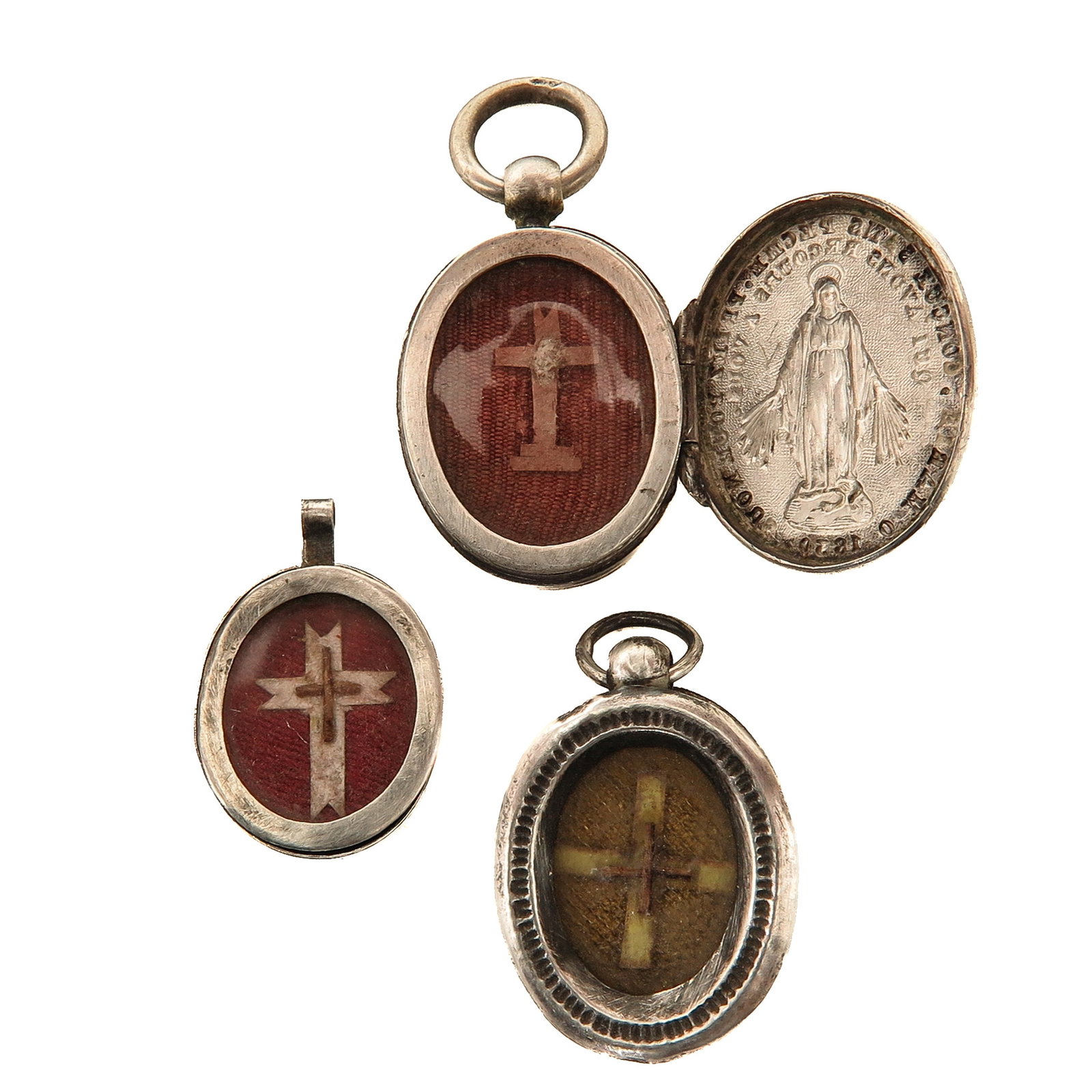 A Group of 3 Silver Thecae: consisting of 3 silver thecae, each with a relic of the Holy Cross, you are purchasing the thecae, the relics are a gift, 2 x 3 cm.