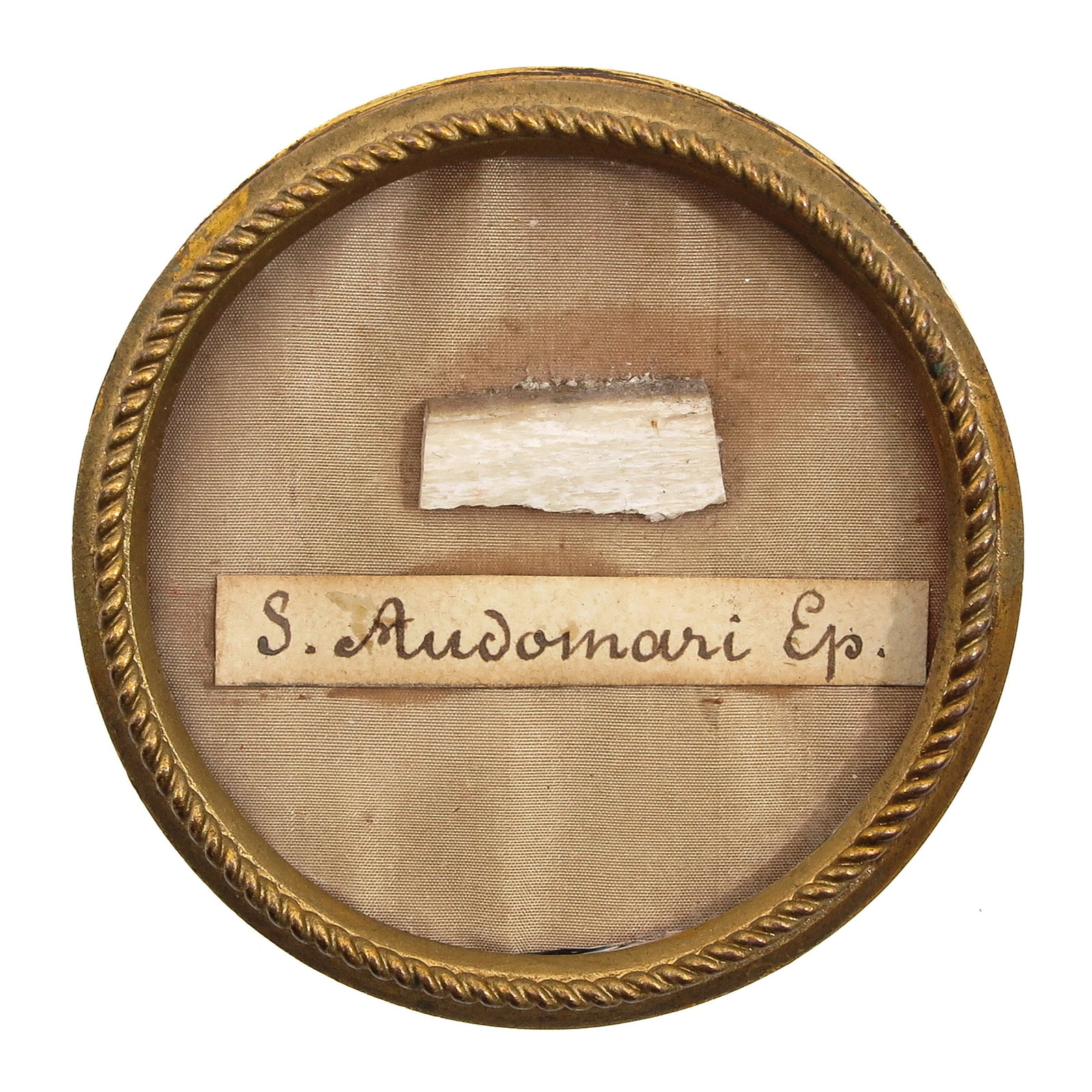 A Sealed Theca: of brass, containing relic of Saint Audomarus (ca. 600-670), also known as Saint Omer, bishop of Th?rouanne and founder of the Abbey of Saint Bertin in Saint-Omer, patron saint of Saint-Omer and