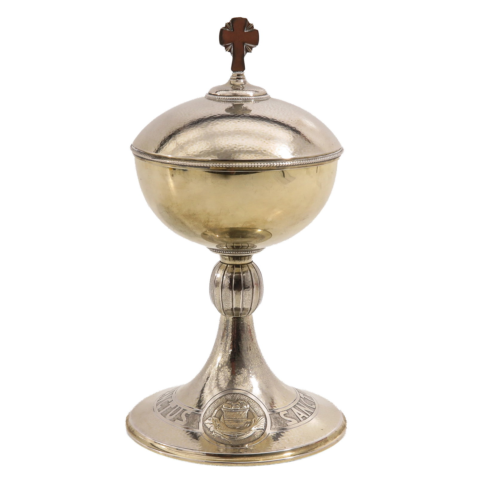 A Ciborium: Art Deco period, with hammered finish, on the foot a medallion with a depiction of the Miraculous Feeding (the multiplication of the loaves and fishes), height 27 cm.
