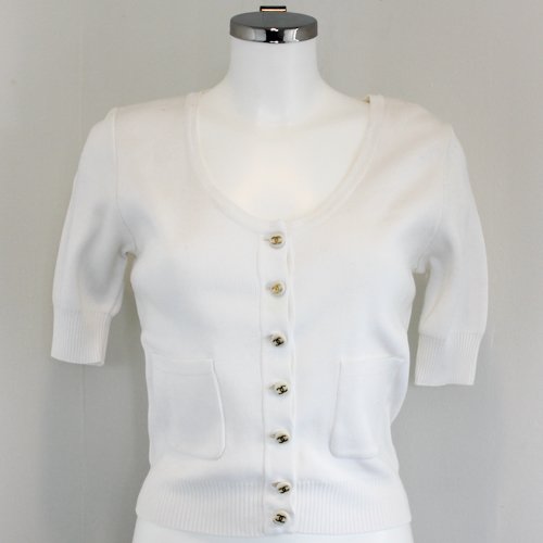 Chanel Classic Ladies Sweater: White is color in classic Chanel tradition with Chanel logo buttons and pockets. Size 40