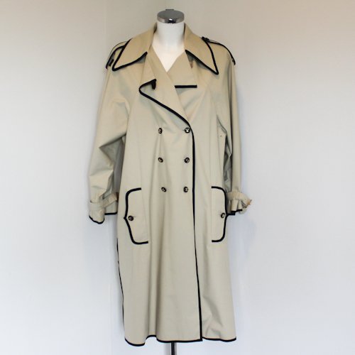 Chanel Ladies Trench Coat: Cotton trench coat from Chanel Vintage featuring a peter pan collar, single chest flap, a contrast double-breasted front button fastening, belt at the waist, contrast black trim detailing, two side bu