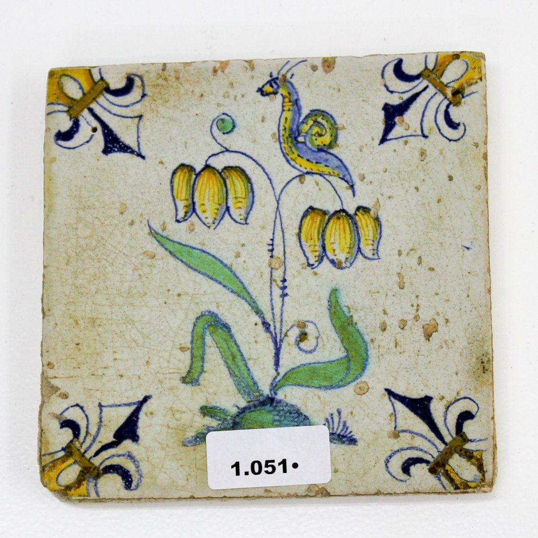 17th Century Polychrome Dutch Tile with Flower and Slug (1 of 2)
