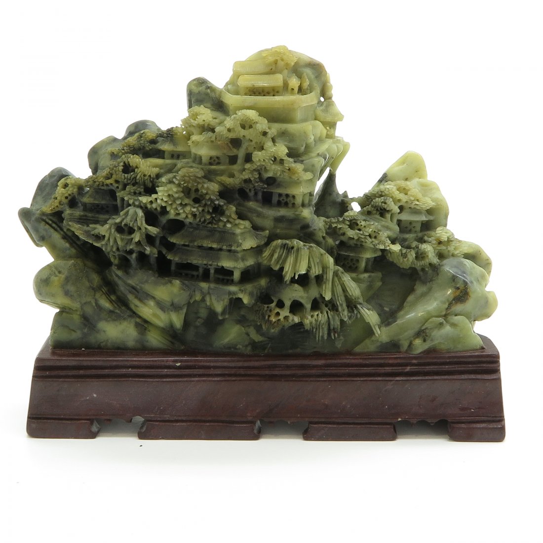 Carved Soapstone Sculpture: 18 x 13 x 6 cm.