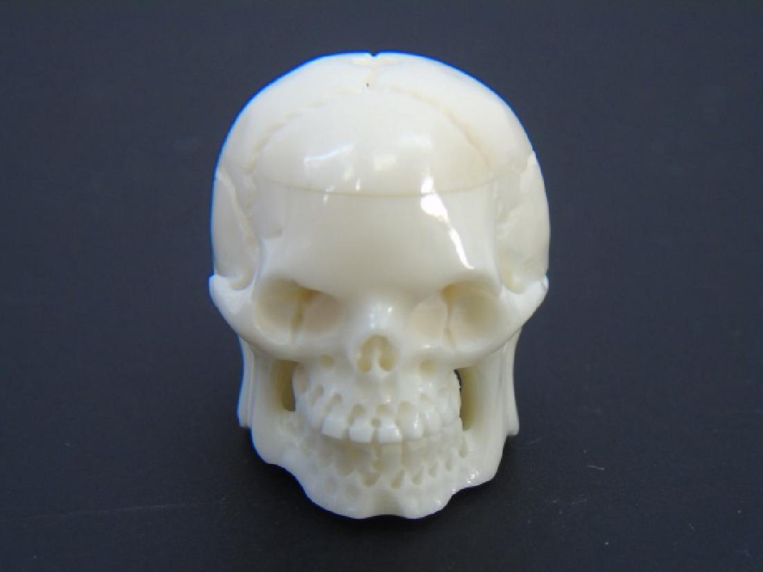 Carved Bone Momento Mori Human Skull Pendant: Carved Bone or Horn Momento Mori Human Skull Pendant. Measures 1 inch in height.