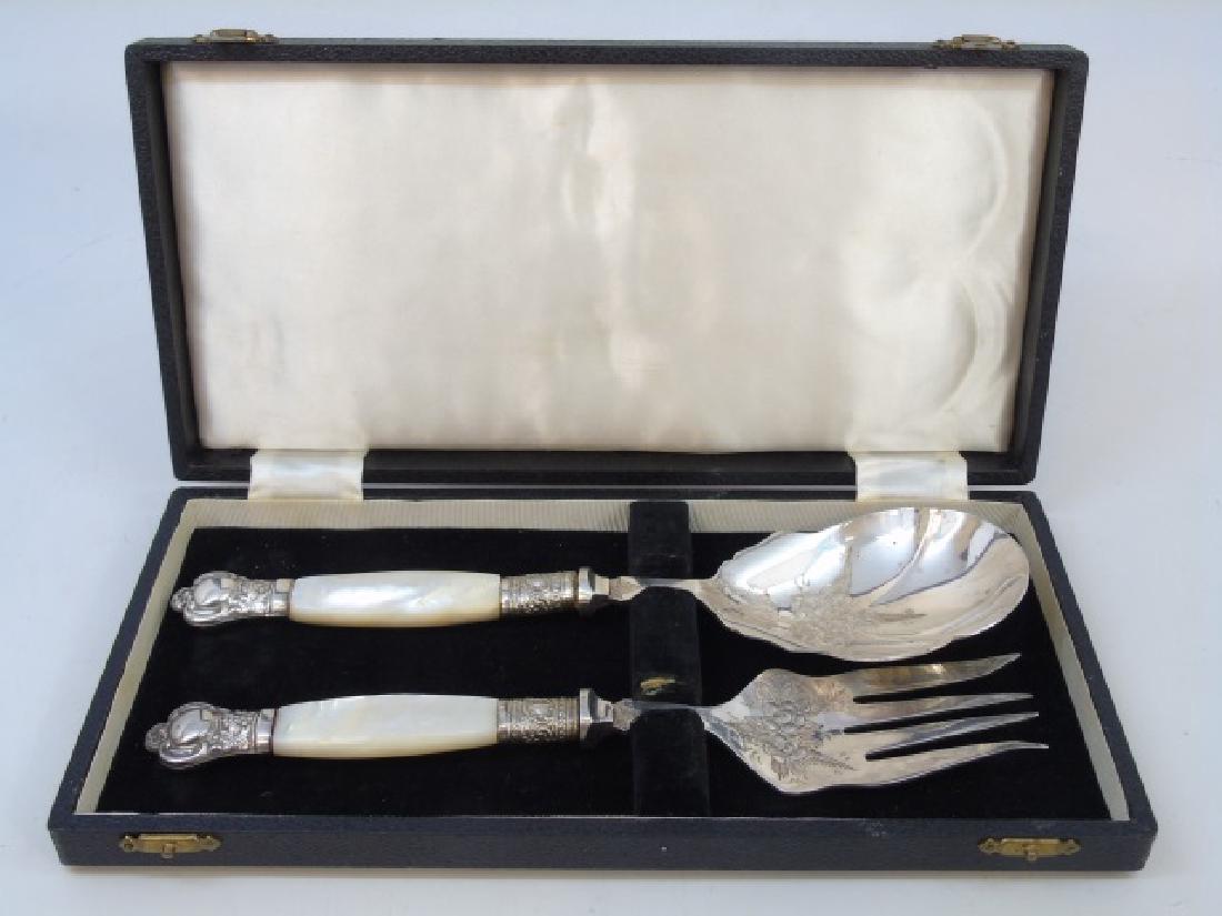 Boxed Sterling & Mother of Pearl Serving Utensils: Boxed Sterling & Mother of Pearl Serving Utensils. Handles are sterling and mother of pearl, utensil portions are plated with chased design. Each measures 10 inches in length.