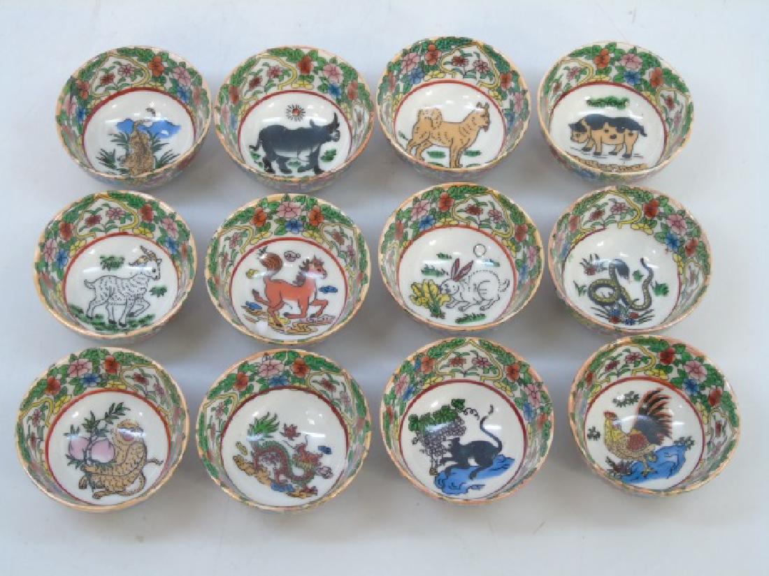 Set of 12 Chinese Porcelain Zodiac Tea Cups: Set of 12 Chinese Porcelain Zodiac Tea Cups. Each measures 2 inches in diameter.